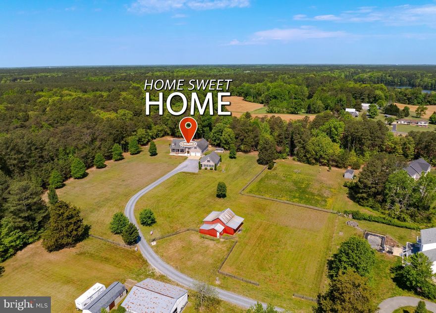 Welcome Home to Your Private Rural Retreat. 
Nestled on 11 serene, private acres and just steps from St. Mary's River State Park, this stunning 5-bedroom, 2.5-bath Cape Cod offers the perfect blend of country living and modern convenience, all within 15 minutes of Patuxent River Naval Air Station and the charming wharf and dining of Leonardtown. A long gravel driveway with freshly installed bluestone chip leads you to a welcoming front porch. The main floor features an owner's suite with a brand new en-suite bath, two additional bedrooms sharing an updated full bath, a fantastic kitchen with ample storage, and an open family room with a pellet stove.  Also on the main level are a dedicated office, a large mudroom/laundry room, and a half bath just off the attached 2-car garage. Upstairs above the garage, two massive additional bedrooms offer incredible flexibility, complete with their own dedicated HVAC system, ideal for guests, teens, or a private home office suite. All HVAC units throughout the home are newer, offering year-round comfort and peace of mind.  Step outside to your screened-in back porch and unwind in the hot tub as you take in the tranquil surroundings. When you're ready for more adventure, miles of trails for hiking, fishing, boating, and even hunting are practically at your doorstep. Car enthusiasts and hobbyists will love the detached 2-car garage, currently set up as the ultimate man cave complete with a theater area and gaming space, easily convertible to a workshop. Bonus storage can be found in the attic above the detached garage. The property also features a barn with potential for horse stalls, making it a dream for equestrian enthusiasts or hobby farmers. Whether you're seeking peaceful acreage, outdoor adventure, or a home that truly has it all, this one checks every box. For qualified VA buyers, this home has an assumable VA loan at 2.25%, a rare opportunity in today's market that could mean significant savings on your monthly payment. Don't miss your chance to make it yours.