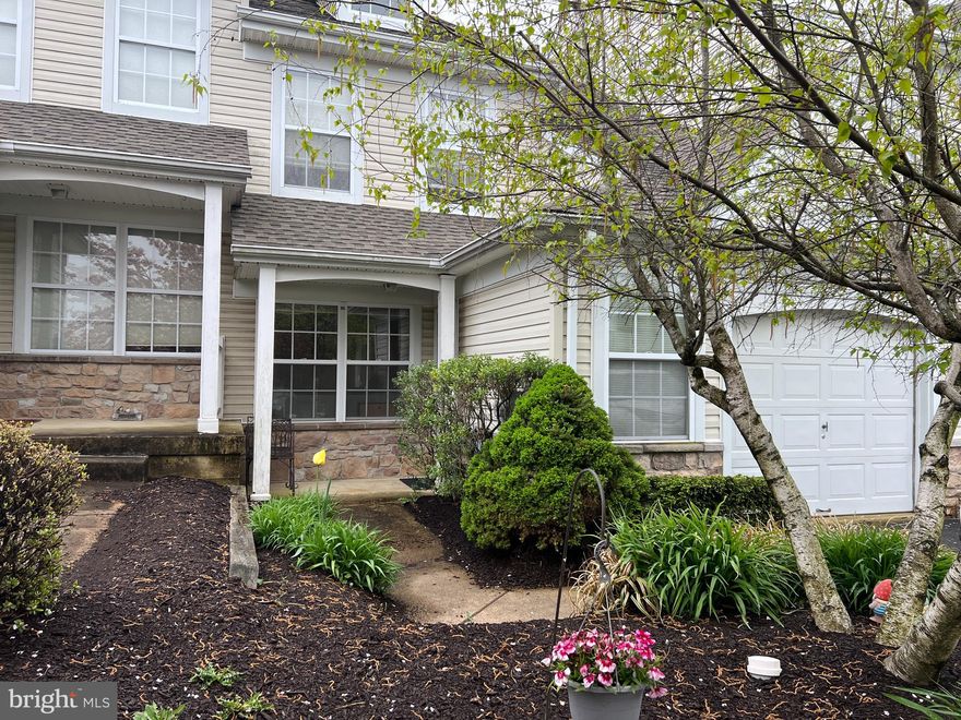 Located in the desirable community of Windrush.  Welcome to this 2 bedroom, 2.5 bath home located on a cul-de-sac.  With beautiful hardwood floors throughout the main floor and a 2 story family room, you will never feel short on space. When you enter through your foyer into the formal living and dining rooms, you have views all the way to the back with this open floor plan. Plenty of natural light throughout from the two story windows in the family room and skylights in the eat in kitchen. A private fenced in brick patio, one car garage with room for storage and a powder room complete this first level. Up the open staircase that overlooks the family room are double doors into your master suite. The bedroom has a tray ceiling, two reading lamps next to the bed and a walk in closet. More double doors into the master bath with soaking tub, stall shower and double sink vanity with linen closet. The second nicely sized bedroom also has its own bathroom with a tub/shower and single vanity. Finally, you have a laundry room conveniently located upstairs.