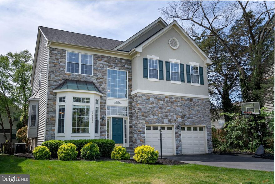 OPEN THURS 4/30 5pm - 7pm and SUN 5/3 1pm - 3pm! North Facing, 5 BR | 3.5 BA | 4,000+ sq ft including finished Basement. This fully-detached, original South Riding Model Home w/ natural stone facade (INVERNESS model w/ added bedroom) sits on a 10,000+ sq ft (.23 acre) fully-fenced flat lot. Main level features oak solid hardwoods and a 2-story Great Room w/ gas fireplace and leading out to a walkout deck landing off Kitchen. separate Home Office, half bathroom, separate Living Room and Dining Room, and renovated Eat-In Kitchen with gas range, center island, deep farm sink, extensive cabinetry / storage, quartz counters and upgraded stainless appliances. Upstairs features 4 bedrooms (with large closets) and 2 full bathrooms, including the large primary suite w/ double closets and large ensuite bathroom.  Laundry also on upper, bedroom level for added convenience. Lower Level features 5th bedroom and 3rd full bathroom, expansive, fully-finished Rec Room with corner dry bar, and large storage / utility room w/ sump pump. Radon remediation system in place.

The backyard is fully-fenced, with a slate patio that sits under a lovely, Japanese Maple tree.  The gardens extend around the side of the house, home to mature landscaping for additional privacy.

Fresh paint throughout and outdoor sprinkler system installed (conveys as-is). Oversized 2-Car Garage features open loft area for significant extra storage. Installation Dates: Dishwasher (2026), Front Hardscaping and aluminum window casings (2022), Washer and Dryer (2021), Roof replacement (2018). HVAC and Water Heater both replaced. Super convenient location (immediate access to Rt. 50) with South Riding amenities for low monthly HOA including Community Pool, Basketball Court, Tennis/Pickleball and walkable to Owen/treehouse Park. Seller requests Rent Back.