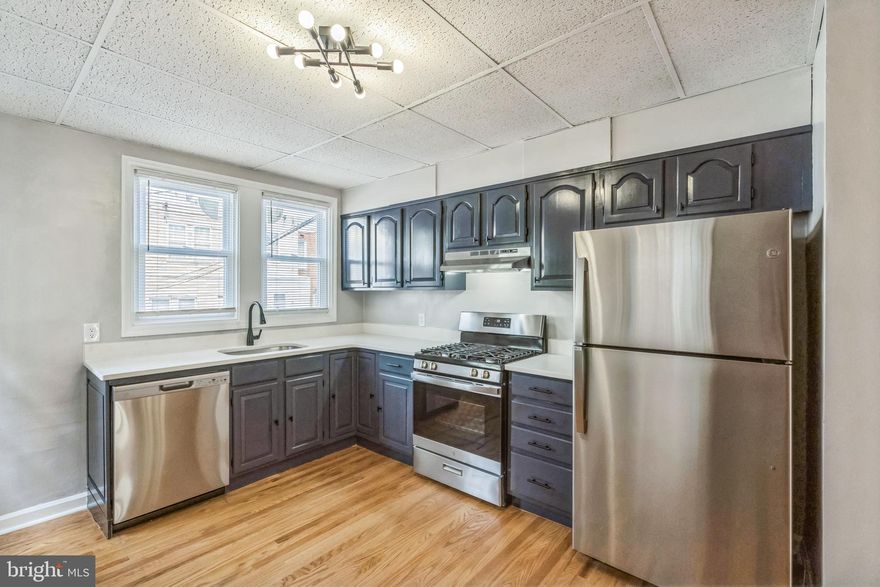 Welcome to 1004 N 67th Street situated on a quiet, tree-lined street in the Overbrook neighborhood of Philadelphia, offering the perfect blend of city and suburban life. This home has been tastefully updated throughout making it a clean and fresh living experience! As you take a step inside, you'll be greeted by a spacious sun filled room with built-in shelving and plenty of natural light. The living and dining areas are perfect for both family gatherings and entertaining guests with gorgeous wood floors throughout! The inspired trendy kitchen features sleek blue cabinetry, BRAND-NEW stainless steel appliances, gas cooking, and plenty of space for a breakfast bar where you could prepare your favorite meals. Upstairs, you'll find three generous bedrooms with ample closet space and a modern hall bath with a skylight to give it a light and airy feel. There is an unfinished walk-out basement with attached garage, providing tons of extra storage space or room for a workshop. Great clean neighborhood with easy access to public transportation, minutes from the Hospital, the Main Line, Center City and shopping in all directions! Access to multiple parks in the area including Fairmount Park, Cobbs Creek and Morris Park which is a few blocks away! This classic and charming home is move-in ready so schedule your tour today!