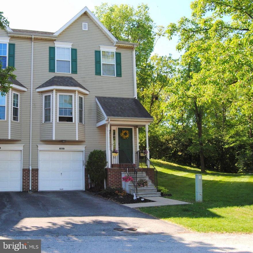 Pride of ownership is apparent in this beautifully maintained townhome situated on a quiet cul-de-sac in the desirable Williamsburg Commons community!  This end-unit townhome has the advantage of extra windows that provide plenty of natural light. The covered entry invites you into a foyer with a spacious closet.  The open floor plan on the main level is perfect for gathering with family and friends.  The bay window provides natural light to the living room, and the half wall between the living room and dining room adds to the open feeling.  The bright renovated kitchen (2023) features white cabinetry, quartz countertops, tile backsplash, ceiling fan, and pantry.  The breakfast area has sliding doors to the rear deck and backyard. A half bath with a pedestal sink and storage cabinet completes this level which has hardwood floors throughout.  Upstairs is a large, sun-lit primary bedroom with two large closets and ensuite bathroom with walk-in shower, tile floor and counter-height vanity.  There are two additional bedrooms and a full bath with linen closet, tile floor, and tub shower.  The lower level has a finished living space that has flexible use as a recreation area, family room or office.  In addition, there is a laundry area, utility room, and generous storage space.  The outside deck is perfect to relax and enjoy the backyard for summer barbecues and outdoor activities. Parking is convenient in the attached garage and driveway with auxiliary parking nearby for your guests. Some additional features include an interior sprinkler system, new roof and gutter guards, and a new hot water heater.  This home is conveniently located to all major commuter routes, the King of Prussia Mall for dining and shopping, Valley Forge Park, and bike paths and walking trails.  Enjoy all that Upper Merion Township has to offer; this home will be a great place to make new memories!