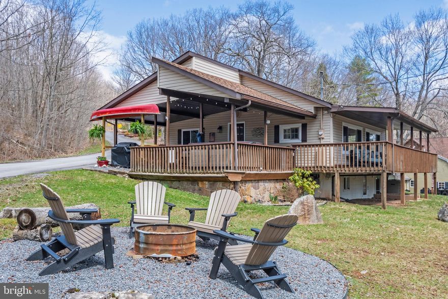 Charming home with lake views and a shared Type A (one dock slip). This cottage has been thoughtfully planned out and decorated to be very inviting. The hardwood floors and stone fireplace add to the coziness, and the large windows afford you beautiful lake views from most rooms on the first floor. The lower level offers a family room and a bunk area, providing more space for family and friends. The large wrap around deck that is partially covered is an ideal space to enjoy all the seasons Deep Creek Lake has to offer. A detached garage offers ample storage for recreational toys. Just a short drive away is your lake access and dock. Established rental "Slips and Slopes". Call today to preview!