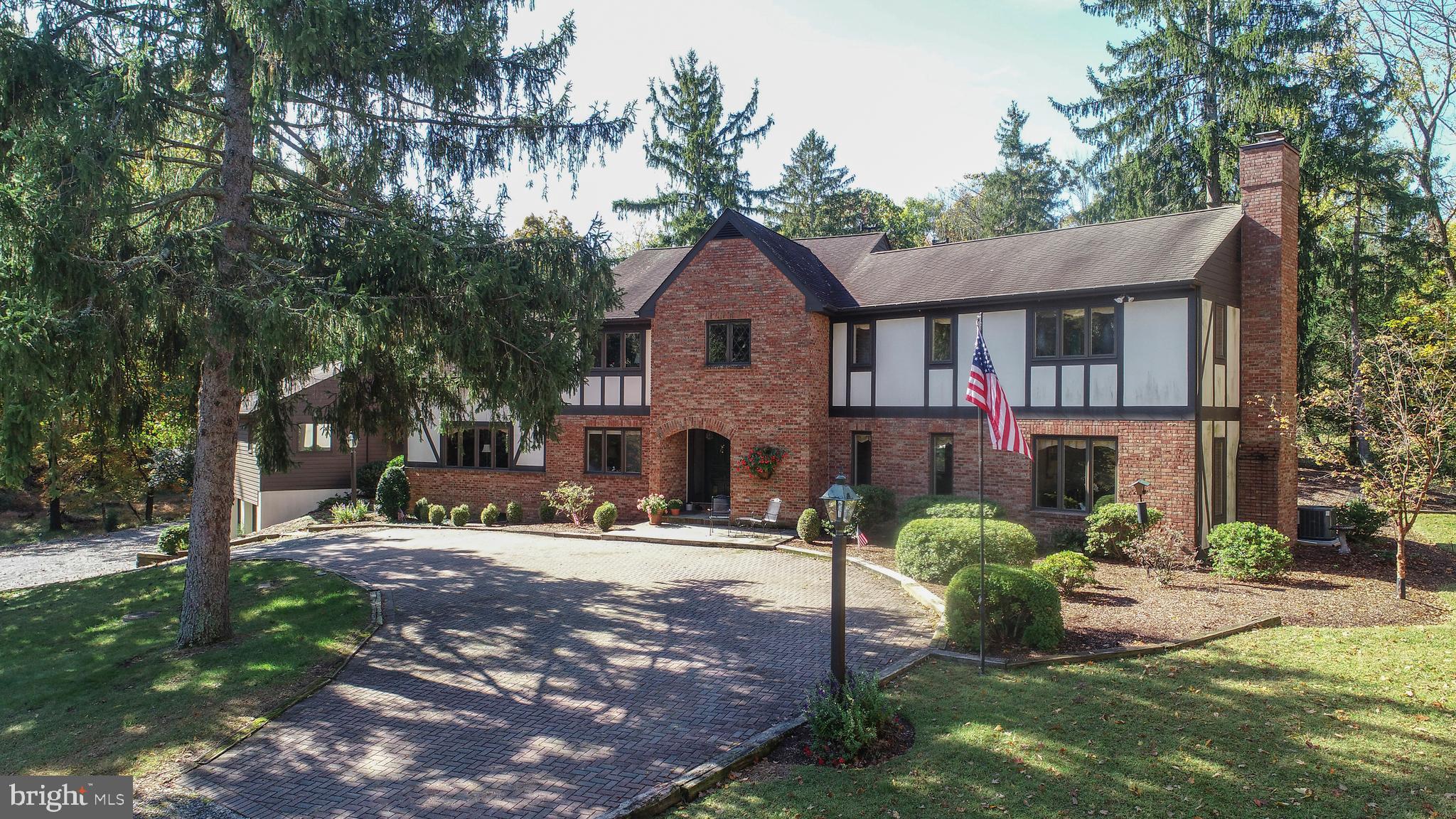 Sited on almost 15 private acres, this thoughtfully designed and mindfully constructed home waits for the special Buyer that really cares about quality. Our setting is magnificent! Rolling hills, tranquil woods, a lovely pond and a meandering creek, just what the nature lover dreams of... With over 5,000 sq. ft. of living space, this residence offers an open gourmet kitchen with breakfast room, a 2 story great room, elegant dining room and living room, 2 fireplaces, beautiful wood floors and spacious room sizes. Exterior features include an in ground pool and a 2 level garage that fits up to 6 cars with hot and cold running water for easy cleanup. "Tally Ho" has been a remarkable place to live for this original owner. It's one of those rare and special homes that occasionally hits the market. It has been meticulously maintained and cared for and we look forward to your visit!