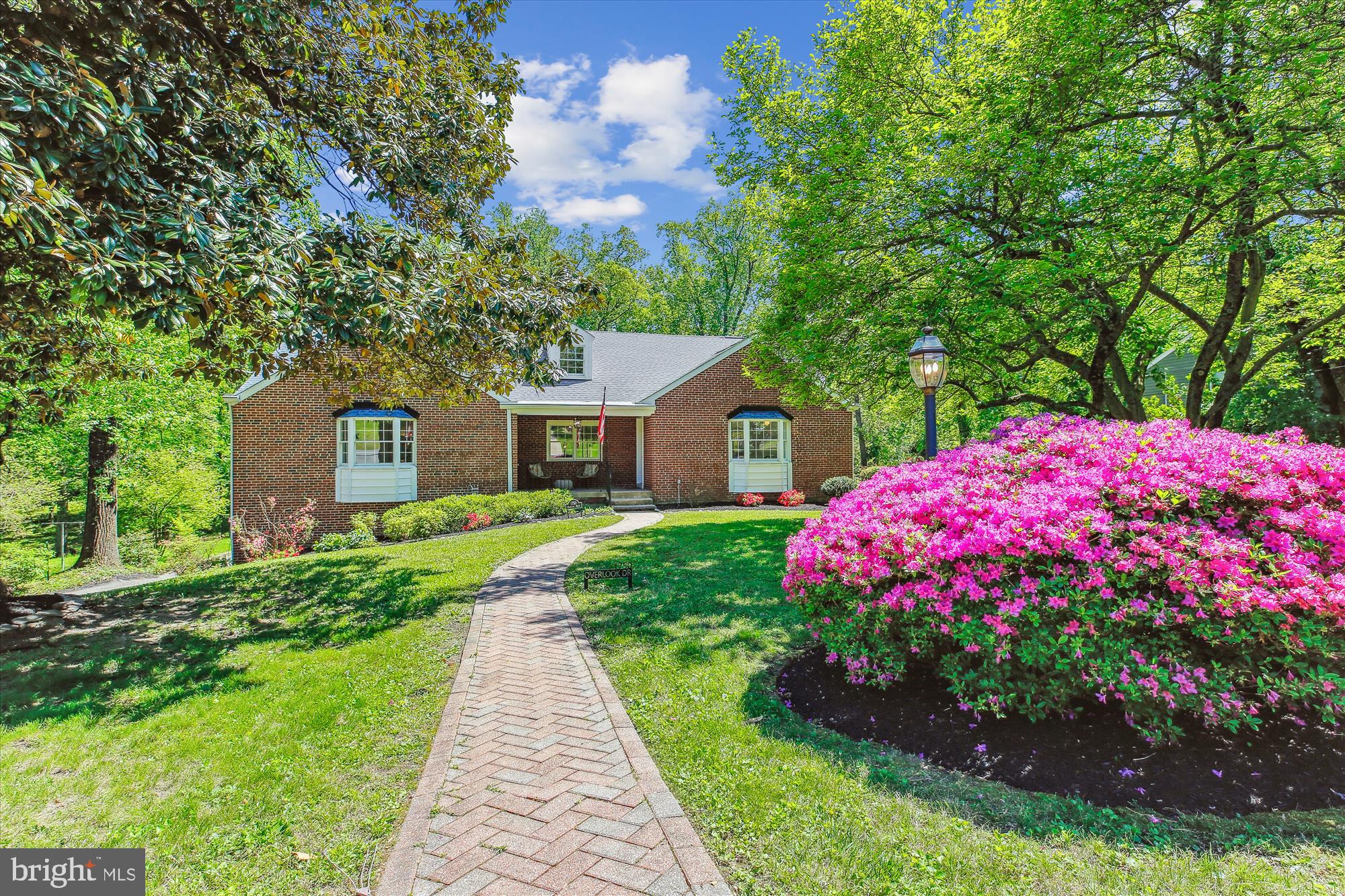 Extremely flexible expanded brick Cape Cod in the sought-after Hillandale neighborhood, freshly painted throughout, and ideally located near shopping, dining, commuter routes, UMD College Park, and the FDA campus. This spacious 6 bedroom, 3 full bath home spans three fully finished, flexible levels with multiple inviting gathering areas and thoughtful updates. Step from the welcoming front porch into a generous living room with a cozy wood-burning fireplace. The formal dining room flows to a large covered porch overlooking the treed backyard. The remodeled kitchen features beveled granite countertops, custom cherry glass-front cabinetry with in-cabinet and under-cabinet lighting, and stainless steel appliances. A sunny breakfast/family room connects to an additional large lower-level family room. The main-level primary suite offers a large walk-in cedar closet, an ensuite bath with dual vanities, and a separate dressing area. Two more bedrooms and an updated hall bath complete the main level - home office and/or den options! Upstairs, enjoy three spacious bedrooms, a full bath, and two walk-in storage closets. The finished lower level adds a recreation room, family room, two storage rooms, a laundry room, and access to the rear patio and attached two-car garage. Don’t miss this rare opportunity to own a beautifully updated home in one of the area’s most desirable neighborhoods!