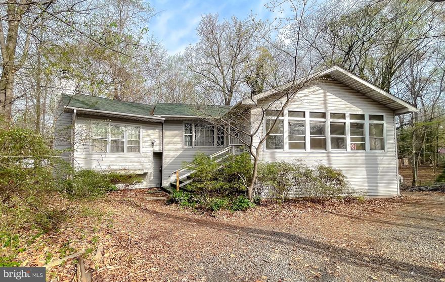 **Back on the market due to buyer financing*** Offering $10,000 Seller Credit!!!! 
Welcome to the charming residence at 12473 Catalina Dr, featuring three spacious bedrooms and 2.5 bathrooms, this home offers ample space for families of all sizes. As you approach, the large enclosed front porch will quickly become your favorite spot for enjoying your morning coffee or evening relaxation. Step inside to the heart of this home: a spacious kitchen which features a large island perfect for meal prep and entertaining. The attached dining area is perfect for family gatherings and celebrations. Connected to the kitchen is the open family room, adorned with vaulted ceilings that create an airy atmosphere, complemented by a cozy wood-burning stove, perfect for those chilly evenings. Retreat to the primary bedroom, which boasts an ensuite bathroom for added privacy, a balcony, and a generous walk-in closet that provides plenty of space for all your wardrobe needs. Storage will never be a concern in this well-thought-out home, featuring a walk-in pantry, a large coat closet, a cedar storage closet, and an attached shed/workshop, equipped with electricity—a dream for DIY enthusiasts and hobbyists alike. The additional living space in the finished basement is a versatile space featuring an exterior rear entrance that could be perfect for a shop or private home office. The spacious circular driveway and attached carport provide convenient parking options for both residents and guests. The large fenced-in backyard is a dream for outdoor enthusiasts, offering plenty of space for gardening, play, and entertaining. With a new roof installed in April 2022, you can enjoy peace of mind for years to come. Situated in a thriving community, this home grants you access to multiple beaches, scenic hiking trails, a playground, basketball court, a community clubhouse, archery fields, and even a private airport! Don’t miss this incredible opportunity—schedule your visit today to experience all that this wonderful home and community have to offer!