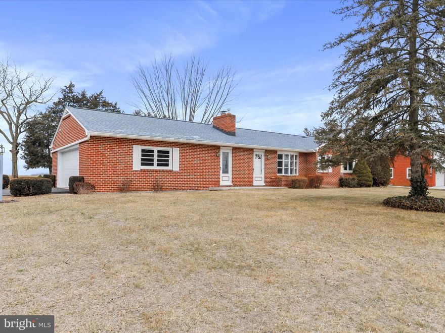 NEW LISTING! Charming All-Brick Rancher in a Peaceful Country Setting! This beautifully updated all-brick rancher offers 3 spacious bedrooms and 2 full bathrooms, featuring freshly painted walls and stunning hardwood floors throughout. The inviting living room boasts a cozy fireplace, perfect for relaxing evenings.  The home includes a newly renovated kitchen with modern finishes, brand-new built-in microwave, dishwasher, refrigerator, and stove. Enjoy additional living space with a lovely 3-season room, perfect for year-round enjoyment.  The full basement provides ample storage space or potential for future expansion. Set on .47 acres, the property offers a serene country setting while still being conveniently close to all amenities. With a 2-car attached garage, this home combines comfort and convenience in a prime location. Schedule your tour today!!