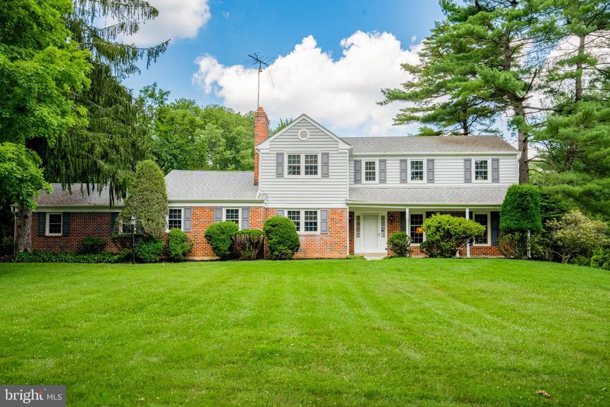 Welcome to this charming colonial home nestled on a very private and beautiful property, spanning a little under 2 acres. The stunning property welcomes you with a lighted brick entrance to the long, tree-lined driveway. As you enter your new home, you'll be greeted by hardwood floors throughout, beginning in the warm and inviting living room on the right, providing a cozy space for relaxation. Journey through to the elegant dining room, which seamlessly flows into the heart of the home where you'll discover a large, beautifully updated eat-in kitchen. This space features a picturesque bay window, center island, cherry cabinets with under cabinet lighting, granite countertops, a Viking gas cooktop stove and top-of-the-line KitchenAid stainless steel appliances, including a double oven. Prepare culinary delights with ease and enjoy meals in the welcoming atmosphere of the kitchen. Continuing through the kitchen, you'll find a den with a wood-burning fireplace, creating a cozy retreat for chilly evenings. Down the hall, there's a convenient half bathroom before entering the family room. This spacious area is adorned with charming wood beams and another brick wood-burning fireplace, exuding warmth and character. From the family room, step out onto the screened-in porch, where you can enjoy the tranquil surroundings and embrace the serenity of the outdoors. A laundry room completes the first level before heading up to the second floor, where you'll discover the primary bedroom featuring an ensuite bathroom with a shower. Three additional large bedrooms adorned with hardwood floors offer ample space for family, guests, or a home office. One of the bedrooms even provides access to a storage area above the garage, ensuring plenty of room for all your belongings. A full bathroom with a jacuzzi tub and a shower with sliding glass doors completes the second floor, providing a peaceful retreat. For additional living space, the partially finished basement offers versatile space and includes a convenient half bathroom and provides access to the garage, ensuring ease of use and convenience. For entertaining, this space includes a third fireplace, pool table, shuffleboard table and bar for hosting friends and family. For outdoor living, a backyard brick patio overlooks the stunning yard, where you can enjoy outdoor gatherings and create lasting memories. Just steps away, an inviting in-ground pool awaits, accompanied by a shed for all your poolside necessities. Additional features of this exceptional home include a two-car garage, a new boiler installed in 2023, and central air conditioning for year-round comfort. This wonderful property is located in the highly regarded Rose Tree Media School District and enjoys proximity to Penn State Brandywine campus, Ridley Creek State Park, and Rt 1, providing easy access to major highways. Don't miss the opportunity to make this exquisite colonial home your own and enjoy the perfect blend of privacy, beauty, and modern comfort. Schedule a showing today and experience the exceptional lifestyle this property has to offer.