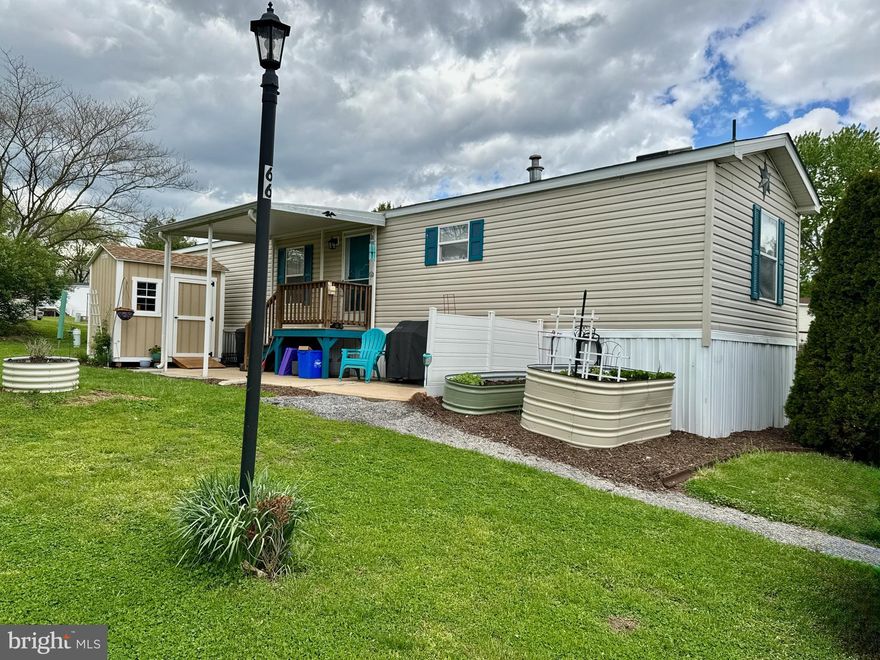 Welcome to 66 Daisy lane! This is the one you have been looking for. Situated on a nice corner lot, this extra large  unit is very clean and well kept and ready for you to move right in .  Special features  include a new roof, new shed, new rear steps, newer dryer, and raised bed planters. Be sure to checkout the video  and schedule your showing now so you can make 66 Daisy lane your new home !