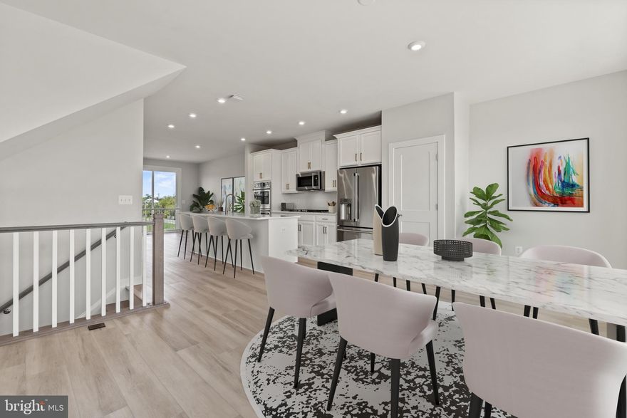 Welcome to The Maya! This exquisite townhouse is a modern dream come true, with 3 bedrooms, 3.5 baths. The open concept floorplan, spanning 2,194 sqft, offers ample space for entertaining or unwinding with loved ones. Indulge in the sleek modern kitchen, complete with top-notch appliances and generous counter space for preparing your favorite meals.

Explore the lower-level recreation room, offering extra space and a full bathroom. Don't miss the rear deck, perfect for barbecues or simply basking in the fresh air.

Step into your primary suite oasis, with a private en suite bath adorned with beautiful tile work. Plus, the spacious walk-in closet ensures easy mornings. This exceptional opportunity at The Maya includes two additional bedrooms on this level with a hall bathroom.

Photos shown are from a similar home.