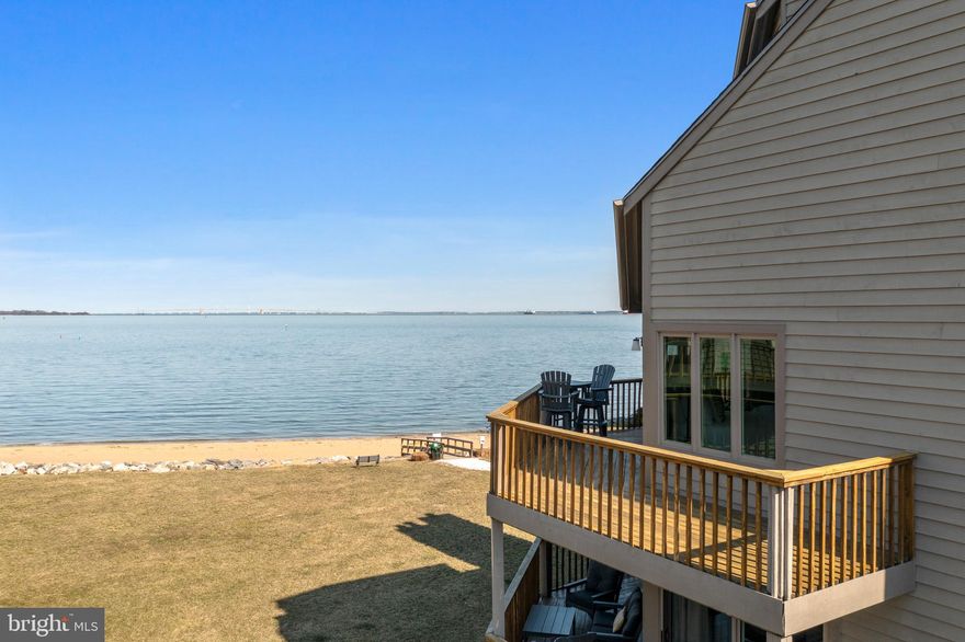 Welcome to this Exceptional Gem with captivating Chesapeake Bay sunrises and Bay Bridge views. This larger end-unit,  four-level townhome stands well above the competition with no expense spared in upgrades since it was purchased in 2022 (see seller disclosures for $400k+ upgrade details).  The new elevator serves all four levels, making the entire home easily accessible. Enjoy water views from every room. The larger end-unit offers additional entertaining space on the multi-level wrap-around decks, and a lower level patio leading to the lawn and the beach.  Light-filled rooms with bay views and two fireplaces.  Updated flooring and custom carpets on the stairs and in the halls. Newer appliances in the chef's kitchen with an island, custom cabinets, and kitchen table space with plenty of light.  Open  floor plan on the main level with ample room for dining with water views. Transition to a generously sized family room with custom blinds, and an updated fireplace that offers a second, more intimate fire-side seating arrangement.  The bedroom level offers a stunning primary suite with unparalleled bay views, custom blinds, new carpet,  a custom closet and a completely renovated primary bath.  Laundry is on the bedroom level and the custom runner leads to a guest room with a vaulted ceiling, en suite bath and custom blinds. The fourth level is accessible by elevator and also provides bay views, an en suite bath, plenty of storage and closet space, custom blinds, as well as room for a desk if a home office is on your list. A second family room, home office or recreation room can be found on the lower level with a wrap-around patio and fast access to the lawn and beach.  The lower level also has a full bath, custom built-in shelving, updated fireplace surround, a custom wet bar with a wine fridge and access to the single-car garage with storage.  The community of Chesapeake Harbour offers an incredible array of amenities including: gated and guarded security, professional management, two community pools (one with bay views), tennis courts, walking trails, beaches, a jetty pier, marina, community grills and public waterfront restaurant.
