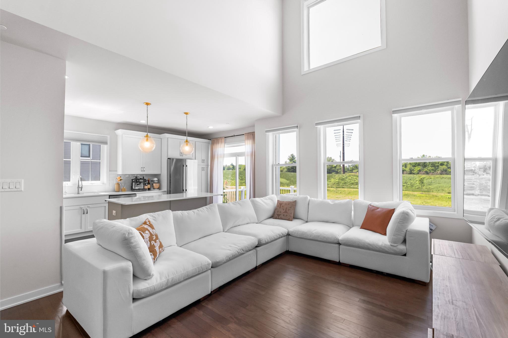 Located in the highly regarded Methacton School District, this Toll Brothers end-unit townhome combines upscale finishes with thoughtful design and functional living spaces. Built in 2022, the home features a finished walk-out basement, a composite deck overlooking open green space, and an ideal layout for modern lifestyles.
This 3-bedroom, 2.5-bath home offers beautiful hardwood floors throughout the main level, a finished walk-out basement, and a composite deck overlooking serene open space. Curb appeal abounds with vertical white siding, a stately stone façade, neutral exterior tones, and a spacious two-car garage.
Step inside through the covered entryway, past a decorative wrought iron barrier, and into a bright, open-concept main level. The living room and kitchen flow seamlessly together, creating a spacious and inviting area for everyday living and entertaining. The kitchen features white cabinetry, quartz countertops, stainless steel appliances, and gold-accented pendant lighting. Four oversized windows flood the space with natural light, and the adjacent deck offers tranquil views of open green space.
Next to the dining area, you'll find a versatile flex room—perfect for a home office, playroom, or study.
Upstairs, the spacious primary suite boasts a tray ceiling, recessed lighting, a luxurious marble-floor ensuite bath with soaking tub and separate shower, and a generous walk-in closet. Two additional bedrooms provide flexibility for guests, children, or additional office space, along with a full hall bath.
The finished walk-out basement offers endless possibilities—ideal for a media room, home gym, or entertaining space—plus ample unfinished storage.
Additional highlights include a two-car garage, an extra-wide driveway, and convenient access to Routes 202, 73, 476, and the PA Turnpike. Enjoy proximity to top shopping, dining, and entertainment options.
Don’t miss your opportunity to own this move-in-ready gem—schedule your private tour of 65 Tamarack Circle today!