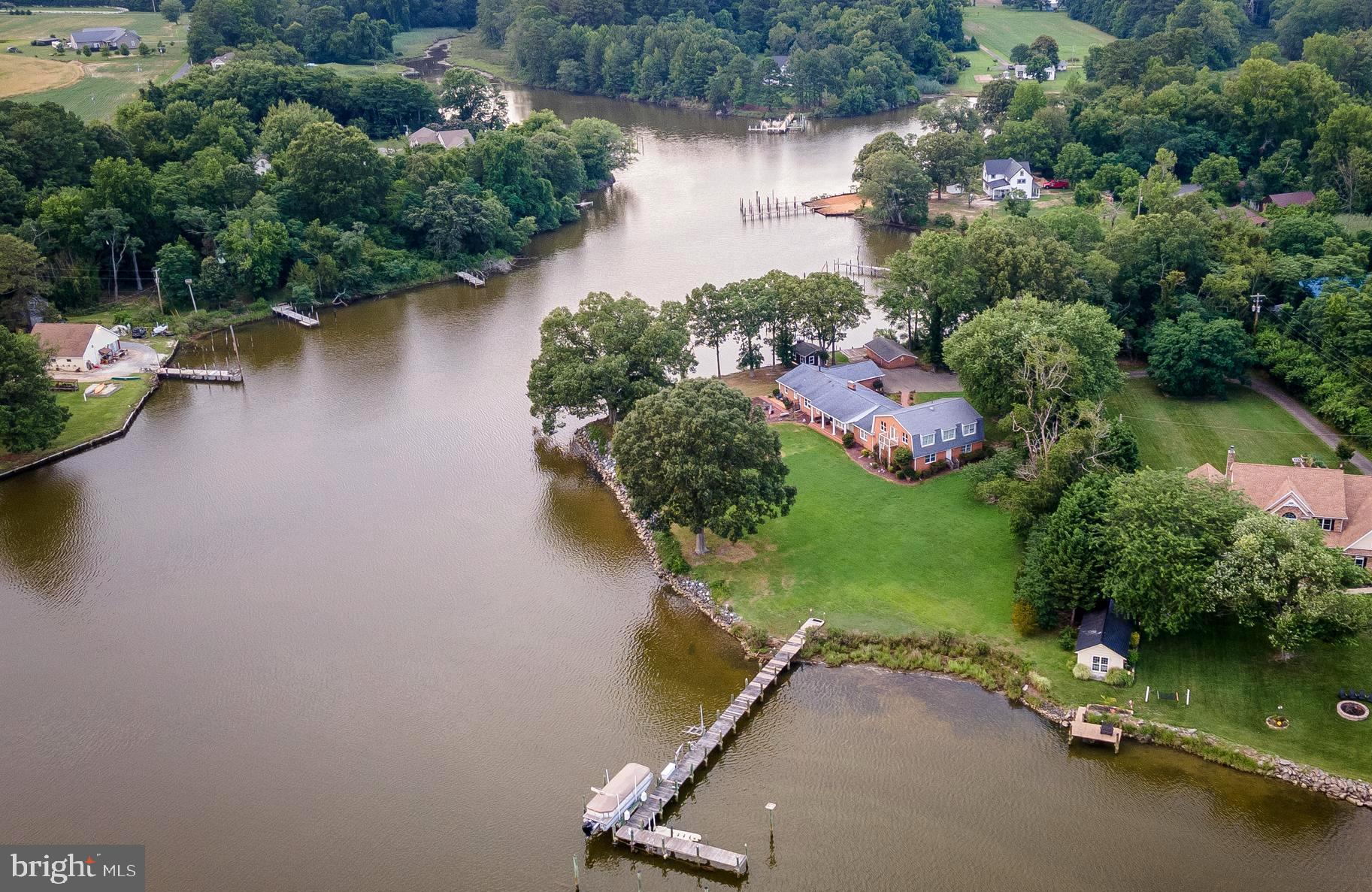 Private Waterfront Retreat on St. Patrick's Creek
Discover this rare waterfront escape in Southern Maryland with over 500 feet of panoramic shoreline on scenic St. Patrick's Creek. Whether you're looking for a spacious family compound or a potential Airbnb investment, this versatile property offers endless possibilities.
The main level features three generously sized bedrooms, three full baths, a home office, and a great room with breathtaking water views and a brick fireplace. The kitchen includes a breakfast bar, walk-in pantry, and plenty of cabinet space—perfect for hosting and everyday living.
Upstairs, you’ll find two additional bedrooms, a huge game room, and a fourth full bathroom—ideal for guests or entertaining.
Additional highlights include:
Dual-zone heat pumps with oil backup
Two hot water heaters
Pier with boat lift and jet ski lift
Attached 2-car garage and 21x21 workshop
Outdoor shower, shed, and additional storage building
Ample closets throughout provide plenty of storage. This is the ultimate blend of privacy, comfort, and waterfront living—just waiting for your vision.