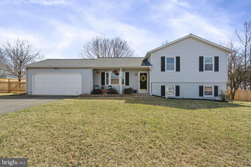 Charming corner lot split level in Vista Woods with attached 2 car garage.  4 Bedrooms and 3 full baths in a split level design offers space for everyone!  The main living area opens into the eat-in kitchen which overlooks the backyard and deck.  Up the short flight of stairs, you will find 2 secondary bedooms that share an updated bathroom.  The primary space is large enough for a king bed and has a refreshed en-suite bathroom.   Downstairs is an added bonus, with a second family room with a slider to the fenced back yard.  This area also has a full bath and bedroom, and would be perfect for guests, or multi-generational living.  
Outside you will find over 1/3 of an acre of fenced space and lots of space to add a hot tub or outdoor kitchen. 



Major remodel in 2021 including roof, kitchen, bathrooms, flooring, deck, water heater, and basement bedroom.  Fence 2022-23 , carpet.
** Please note, fireplace has not been used in 2 years.  It was found to be leaking and deficient by contractor. Chimney Cap was replaced , chimney flue was sealed, and has not been used since. Fireplace/Chimney convey as is**