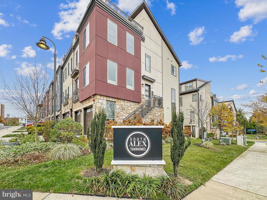 Welcome home to a beautifully designed townhome in the highly sought after Towns at South Alex. This sophisticated residence offers the perfect blend of luxury, comfort, and unbeatable convenience. Commuting is effortless with the Huntington Metro, I-495, and Reagan National Airport just moments away. Enjoy quick access to The Pentagon, Amazon HQ2, historic Old Town Alexandria, Washington D.C., Fort Belvoir, and endless dining and shopping options. You can even stroll to the recently added Aldi and PJ’s Coffee just a block from your front door.

From the moment you step inside, you’ll notice the thoughtful craftsmanship throughout. Custom molding and gorgeous hardwood floors flow across all four levels, creating an atmosphere of modern elegance. The open concept main level is designed for seamless entertaining. The gourmet kitchen features a striking twelve foot island, premium gas range, premium electric oven, stainless steel refrigerator, and an upgraded herringbone pattern backsplash. The spacious family room is filled with natural light thanks to massive windows, and the adjoining patio is perfect for grilling on the weekend.

Upstairs, the bedroom level provides a peaceful retreat. The owner’s suite features dual closets, and a spa inspired en suite bathroom with a double vanity, beautifully tiled shower with bench, and a freestanding soaking tub that is perfect for unwinding after a long day. The additional bedroom and office includes "Closet by Design" built in desk and storage and a Murphy bed with built in cabinetry, creating a truly flexible space for work, guests, or both.

The top level offers a spacious third bedroom with its own full bath, ideal as a guest suite, home office, or creative studio. The sky is the canopy perfect for dining al fresco and enjoying your beverage of choice to unwind with cherished friends and neighbors. 

The finished lower level adds even more versatility. Complete with a second half bath, surround sound, and a dramatic custom twelve foot fireplace in gorgeous white stone flanked by glass display shelving, this level is perfect as a home gym, media room, or play space. It also provides direct access to the two car garage.

Storage is thoughtfully maximized throughout, including smart garage storage solutions ideal for seasonal décor and those big Costco hauls. Parking is effortless with three total spaces. You have two in the garage plus one Red Star Lane parking pass. Parking on Red Star Lane is reserved exclusively for the Towns at South Alex and spaces are almost always available.

This exceptional home truly has it all. Come see it this weekend.