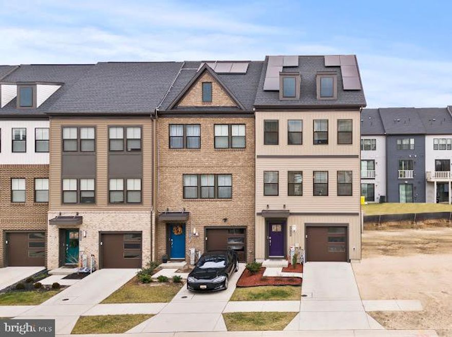 Welcome to 7711 Red Moon Way, a stunning end-unit townhome in the highly sought-after Tanyard Shores community. Built in 2022, this like-new home offers 4 bedrooms, 2 full baths, and 3 half baths, along with modern finishes, flexible living spaces, and an exceptional layout designed for today’s lifestyle.
The entry level features a convenient half bath and a spacious recreation room that can easily function as a 5th bedroom, home office, playroom, or gym, with access to the garage and fully fenced yard.

The main living level showcases a bright open-concept floor plan with the kitchen at the center of the home, a second half bath, and seamless flow into the living and dining areas. Step out onto the composite deck off the living room, perfect for morning coffee, entertaining, or relaxing outdoors.

The upper level offers four generously sized bedrooms, including a primary suite, two full bathrooms, and an additional half bath for added convenience. A second composite balcony off the loft area on the top level provides another private outdoor retreat. The washer and dryer are conveniently located on the bedroom level.
Additional highlights include dual-zoned HVAC, tankless gas hot water heater, gas heat and gas cooking, electric A/C, solar panels, and water access to Marley Creek.

Enjoy resort-style living in Tanyard Shores with amenities including a community pool, clubhouse, fitness center, dog park, boat ramp and dock, and scenic wooded walking trails—all just steps from home. This is low-maintenance living at its finest with unmatched community features and water access.