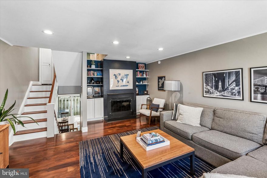 Tastefully updated 2 bed 2 bath home with attached GARAGE on a quiet Bella Vista block. Enter from the sidewalk or the garage into a foyer with plenty of space to welcome you home and offer a graceful “drop zone” for coats, shoes, backpacks, etc. Just a few steps up, you’ll find a nicely sized eat in kitchen with sliding doors to a rear patio perfect for outdoor dining. The spacious living room features a wood burning fireplace, beautiful built in shelving and cabinetry, large eastern facing windows that get fantastic morning light, and plenty of space for entertaining. On the next level you’ll find a bedroom with good closet space and a hall bathroom with crisp white subway tile. Upstairs you’ll find the primary suite featuring an en suite bath with a large glass tiled shower. At the very top, you’ll find an inviting deck with great city views and a sliding glass door that floods the house with afternoon light on sunny days. Finally, back downstairs, just a few steps down from the entry foyer, you’ll find a lower hall closet and a nicely sized unfinished room with laundry, mechanicals, and plenty of storage space.

Seller has made extensive updates throughout to both finishes and systems - including replacing all floors, banisters, updating bathrooms, refacing the fireplace and hearth and adding custom cabinetry and shelving, new HVAC, updating appliances - just to name a few (see agent for full inventory of improvements).

Fabulous location - in the heart of Bella Vista but on a very quiet, low traffic block. Just footsteps from WholeFoods, Acme, Seger Park playground and dog park, Palumbo Recreation Center, 9th Street Italian Market, and countless great restaurants, bars, shops. A quick walk to center city and easy access to multiple public transit routes. Don’t miss this wonderful move in ready home in the heart of it all. Schedule your visit today!