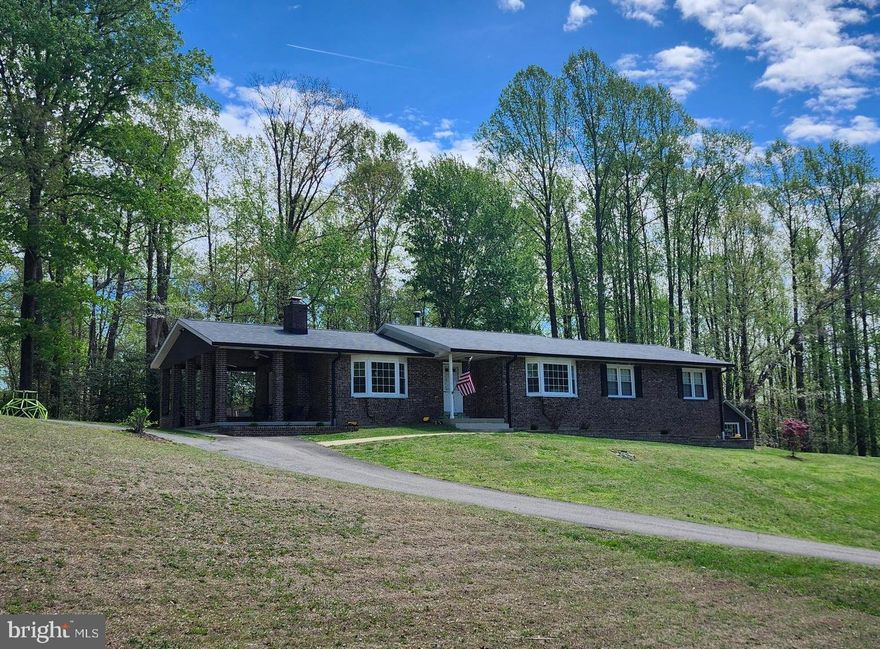 Terrific One Level Living 3 Bedroom, 2 Bath Home on 1.33 Acres with Family Room with Pellet Stove insert off the Kitchen, Separate Living Room, Country Kitchen with Breakfast Counter that is open to the Dining Room and Laundry Room.  Appliances are Updated. The Outside Areas also Feature a Large Covered Porch/Patio off the Family Room as well as a Covered Front Porch.  The home is also perfect for Automobile, Boating, Hobby, and Sports enthusiasts with an  Oversize Detached 2-Car 660 sq. ft.  Garage with plenty of  additional Garage Space for Projects and Storage plus additional Covered 2-Car 600 sq. ft. Carport Space all under the same Brand New Roof. There is plenty of shelter and parking. There are also two good sized outbuildings for yard equipment, mower, tractor and utility storage. The recent Upgraded and Maintained attention to the home include: HVAC/Heat Pump 2022, Well System w/ Well Pump, Pipe, and Pressure Tank 2024, New Gutters 2025, Detached Garage/Carport Roof 2026, New Flooring 2026, All Plugs and Switches 2025, Water Heater 2017, Duct Cleaning 2025, and Septic Pumped summer 2024.
The Association Recreation Fee Includes Water Access Features mentioned separately.