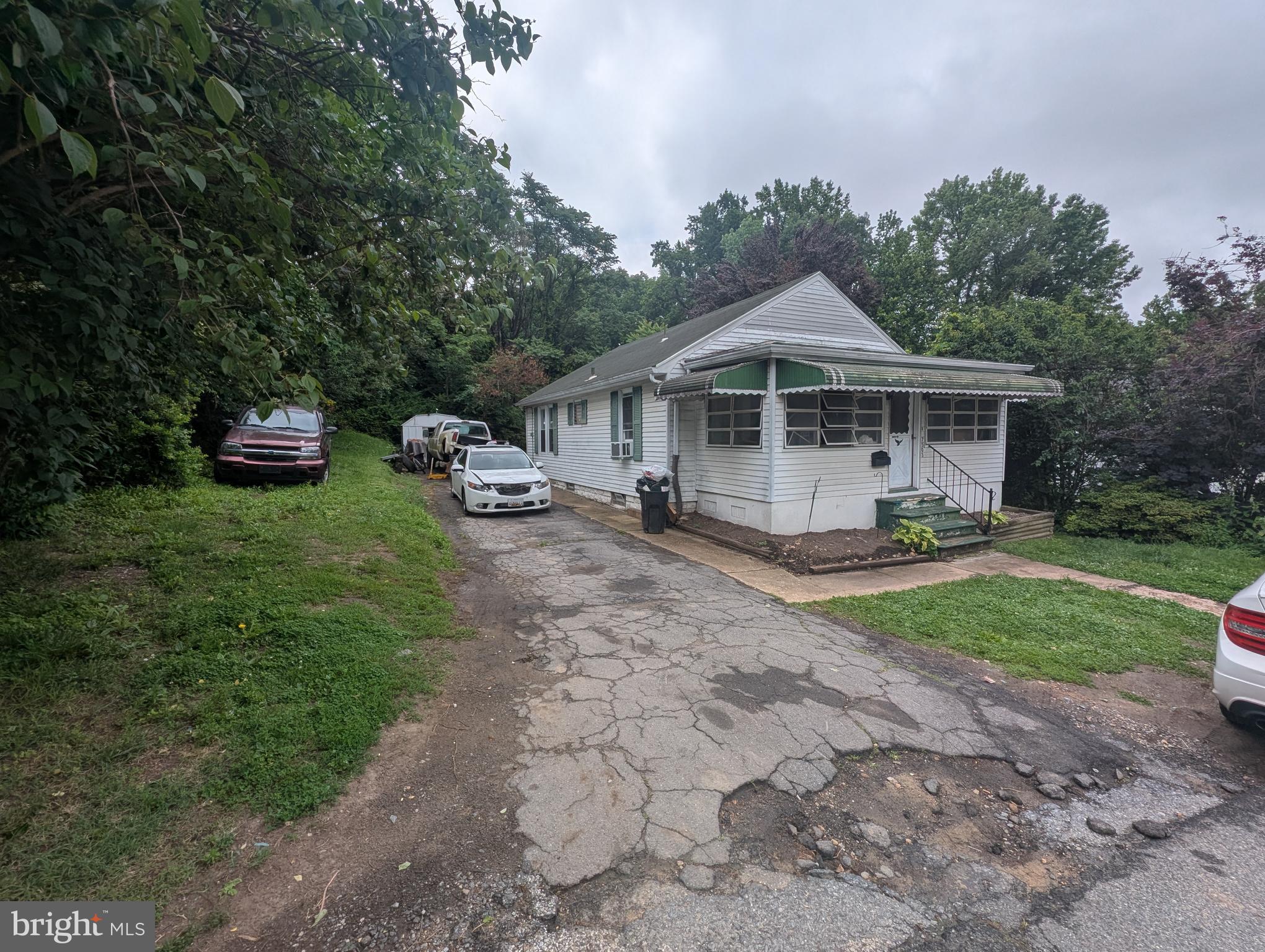 Investor Special or Handy Homeowner Opportunity!
Welcome to 7503 Riddle Ave, located on a quiet street in Baltimore County. This home offers a spacious layout and plenty of potential for the right buyer. Bring your vision and your toolbelt—this property needs significant work but has great bones and solid value-add potential.
Out front, you'll find a large driveway that easily accommodates up to four cars, making parking simple and convenient. As you approach the home, you're greeted by a covered and enclosed front porch, perfect for enjoying morning coffee or adding extra storage space. Step inside to a comfortable living room, which flows into a dedicated dining area, ideal for hosting or family meals. Off the dining room, a hallway to the left leads to a full bathroom and two main-level bedrooms offering the ease of single-floor living.
Beyond the dining room, you'll find the kitchen, which opens to a second enclosed porch in the rear of the home—a versatile space that could serve as a mudroom, sunroom, or storage area. The private backyard features a shed and room to create your own outdoor retreat.
The lower-level basement is mostly open and provides a large area that’s ready to be finished to your liking. It also includes a separate room that could function as an additional bedroom, home office, or hobby space.
The home is equipped with 200-amp electrical service, oil heat with radiator distribution, and central air conditioning (needs Freon). It also features an electric hot water heater, electric range, and a front-loading washer and dryer with an electric dryer.
This property is being sold AS-IS and is priced to reflect the repairs needed. Cash or conventional financing only—will not qualify for FHA or VA loans. Whether you’re an investor or a buyer looking for a project with great potential, 7503 Riddle Ave is a fantastic opportunity to build equity and make it your own.
Schedule your showing today and bring this diamond in the rough back to life!