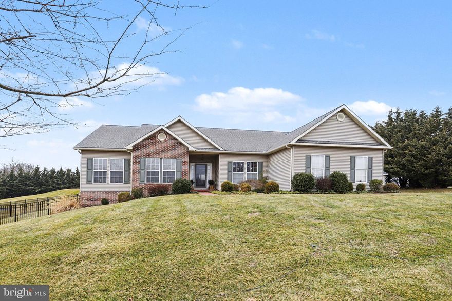 Enjoy one-level-living in this spacious rancher situated on a 1.1 acre lot in Littlestown School District. Thoughtfully designed for both comfort and functionality, this move-in ready home offers a bright, open layout that feels inviting from the moment you step inside. The main floor features beautiful hardwood floors, separate living and dining rooms, an eat-in kitchen with white cabinetry and granite countertops, a dedicated office, and a spacious sunroom with views of the rear yard. The owner's suite features a large walk-in closet and an ensuite bathroom with double sinks and a soaking tub. Two additional bedrooms, a full bathroom, and a laundry room complete the main level. The lower level is finished offering even more living space that includes a large rec room and family room with a wet bar perfect for entertaining, a full bathroom, a versatile bonus room that could be used as a 4th bedroom, an exercise room, and storage space. Outdoors features a beautifully landscaped 1.1 acre lot, a rear patio, and a large fenced-in backyard ready for relaxing, entertaining, and outdoor enjoyment. Conveniently located close to all Littlestown amenities, Gettysburg, Hanover, and the PA/MD line. This one won't last long! Schedule your private tour today!