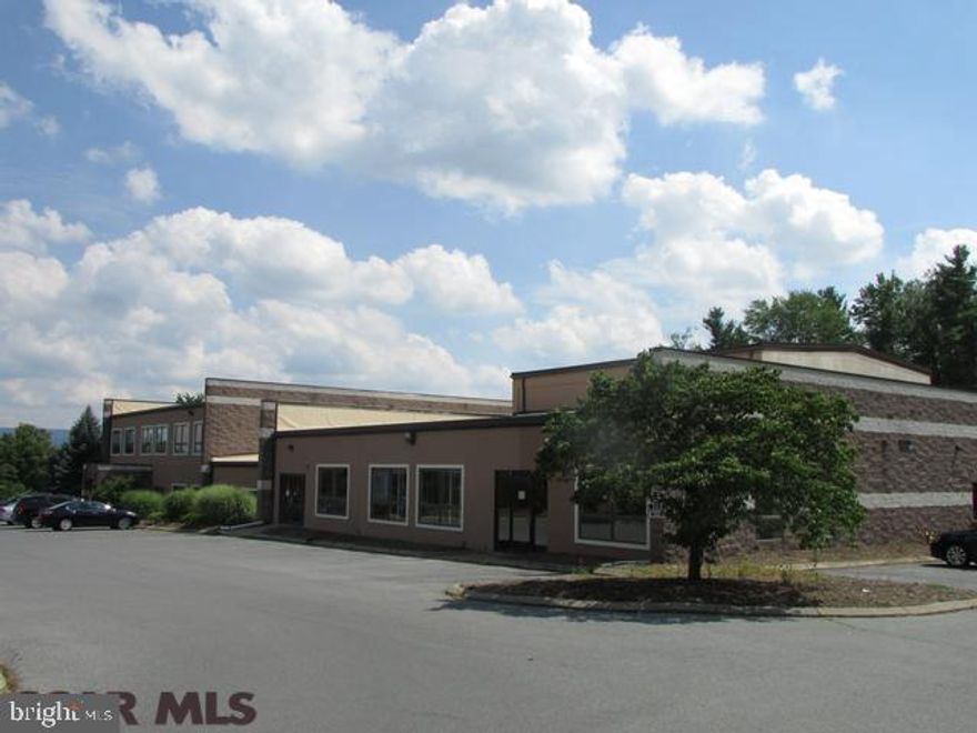 Prime complex located 1.5 miles from PSU Campus and 1.1 miles from I-99. This property has excellent rental income and great tenants. 34,000+ sq ft building, 149 parking spaces, recently updated dryvit and roof. The State College area is booming! Don't miss your opportunity for this solid investment.