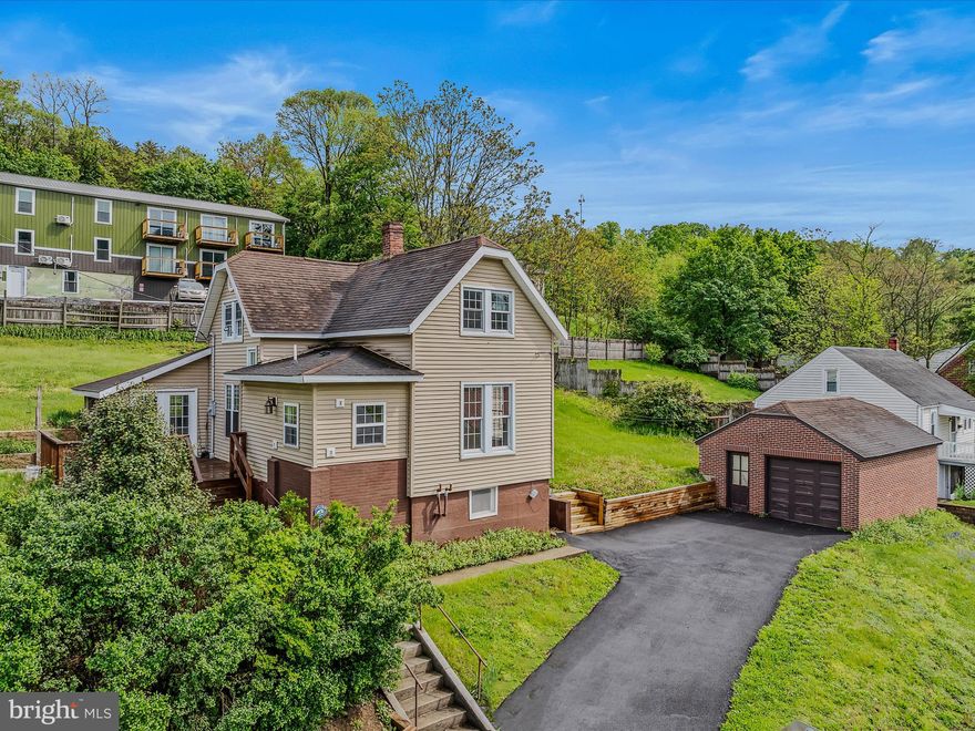 Beautifully remodeled home close to downtown Berkeley Springs.  3 bedrooms and 2 full baths.  Open floor plan on the main level with plenty of space.  New appliances, new flooring, fresh paint, and lots of natural light are bonus features. Enter into the sun porch with plenty of windows.  Main floor living is possible with laundry, a bedroom, and a brand new bathroom on the first floor.  Upstairs are 2 bedrooms and another new bathroom.  Plenty of storage in the basement area with outside and inside access doors.  A detached garage can also act as a workshop/hobby area. A new retaining wall, a large yard, a deck, and fencing are great outside features.  Central heat and air, original brick touches, and exposed retro floor joists are more great interior features.  A must see property in a great location!