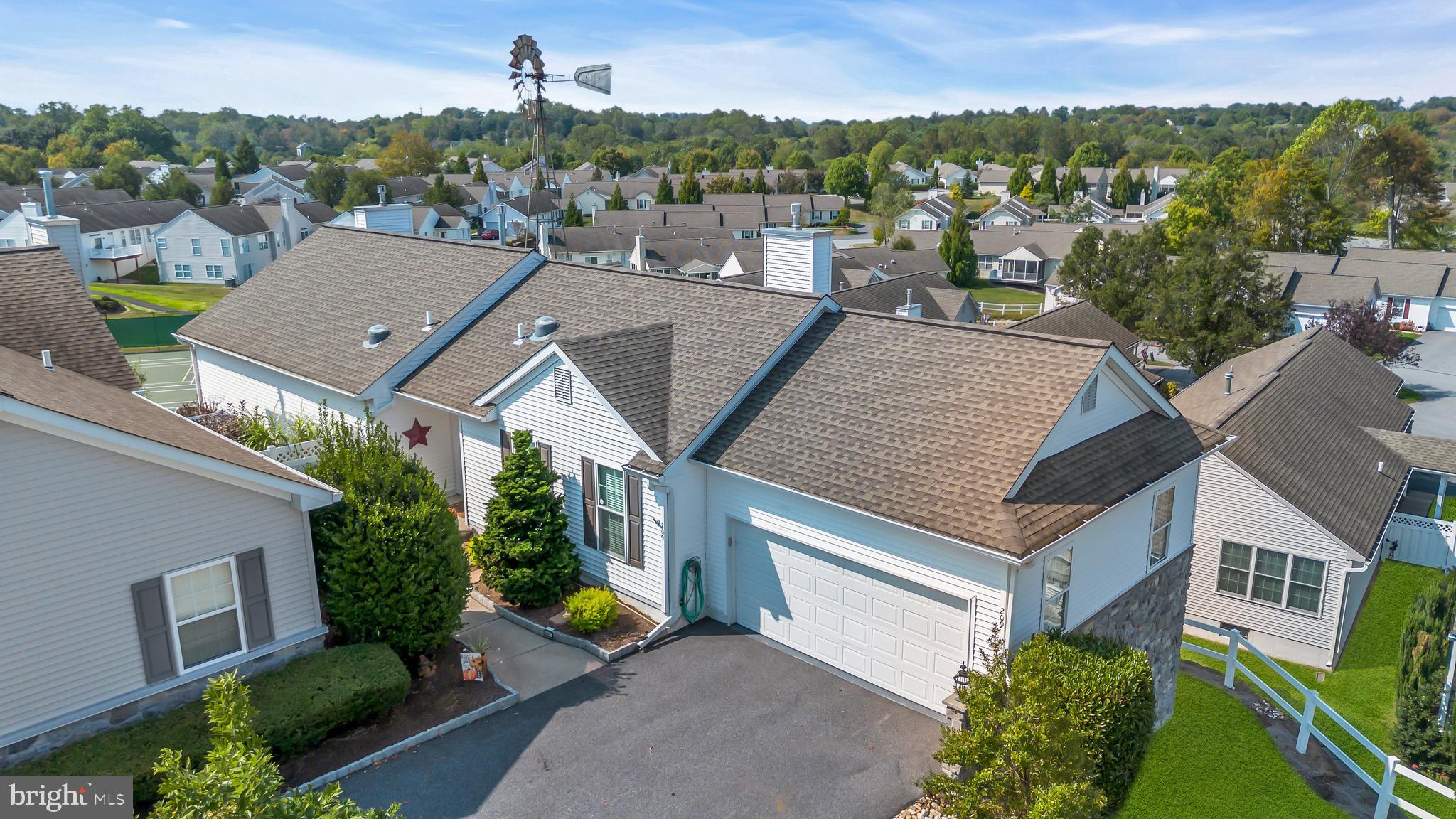 This exceptional original Adams model in Fox Hill Farm combines resort-style amenities, upgraded finishes, and a premier setting with breathtaking views.
Perched at one of the highest points in the community, this home enjoys expansive views by day and unforgettable sunsets by night, best enjoyed from the comfort of the screened-in porch.
Inside, the heart of the home is the renovated kitchen, designed with upgraded white cabinetry, quartz countertops, stainless steel appliances, a center island, and ample cabinetry and counter space. The kitchen opens seamlessly to the family room with an updated gas fireplace and sliding doors to the screened-in porch—perfect for entertaining all year round. This area is finished with new hardwood flooring.
A second open living and dining area features another updated gas fireplace and is filled with natural light, blending comfort and flexibility for dining, entertaining, or relaxing. The primary suite includes a walk-in closet, an updated bath with double sinks, a tiled walk-in shower and additional closet storage. The second bedroom is served by a full bath that also functions as a convenient guest bath. Additional highlights on the main level include a spacious laundry room w/cabinet storage, three solar tubes bringing in extra natural light, and an attached two-car garage. The attached two-car garage is complemented by an extended driveway, offering plenty of parking for guests.
The finished walk-out basement expands the living space with a bright open area flexible enough for a media room, home office, gym or separate living area along with a half bath, storage room & utility room. Windows were replaced by the previous owner.
Fox Hill Farm’s amenities include indoor and outdoor pools, tennis, pickleball, bocce, shuffleboard, walking paths, a fitness center, game and craft rooms, library, and a full calendar of clubs and events. Ideally located near Glen Eagle Square, Whole Foods, Wegmans, Costco, Target, Longwood Gardens and Delaware tax-free shopping, along with upscale dining, charming local restaurants, and nearby wineries, plus easy access to all major routes.
Enjoy the perfect balance of peaceful privacy, modern comfort, and an active community lifestyle in this exceptional Glen Mills home.