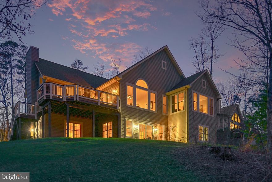 Welcome to lakefront living on the public side of Lake Anna in the Freshwater Estates community, ideally positioned for convenient access to everything the lake has to enjoy. This custom-built home delivers a seamless blend of comfort, space, and year-round living, all set within a quiet, protected cove.

With five bedrooms and three full bathrooms across two levels, the home offers generous space for both everyday living and hosting. The interior is highlighted by vaulted ceilings and a striking wood-burning stone fireplace that anchors the main living area, creating a warm and inviting feel. The family room flows seamlessly into the kitchen, featuring custom cabinetry, stainless steel appliances, and granite countertops, along with a spacious island ideal for gathering. Designed to take full advantage of its setting, the home captures water views from nearly every room, making the lake a constant backdrop. 

Step outside to a waterfront setting thoughtfully designed for both relaxation and recreation. A private covered boathouse with two slips—one equipped with an electric lift—pairs with a spacious dock to create an exceptional setup for life on the water. Tucked within a wide, protected cove, the property invites swimming, kayaking, paddleboarding, and fishing, with approximately 6 feet of water depth off the dock. From here, enjoy the perfect balance of serene cove living and effortless access to wide open water—ideal for boating, skiing, wakeboarding, and full days on the lake. 

Previously part of a successful short-term rental program, this property offers excellent flexibility for both personal use and investment potential, with short-term rentals permitted within the community.

Conveniently located within easy reach of Richmond, Washington, D.C., and Northern Virginia, this home offers an ideal getaway without feeling far from home. In close proximity to area favorites including Cutalong Golf Club, Tim’s at Lake Anna, Callie Opie’s Orchard, and Lake Anna Winery, you’ll enjoy both the lake lifestyle and easy access to some of the area’s most popular destinations. 

Whether you’re looking for a full-time residence, a weekend retreat, or an income-producing property, this home captures the laid-back lifestyle Lake Anna is known for—where days are spent on the water and evenings unwind with peaceful sunsets and storytelling by the fire.