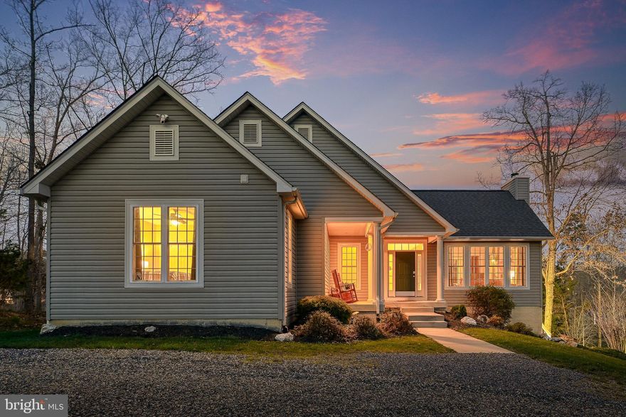 Welcome to lakefront living on the public side of Lake Anna in the Freshwater Estates community, ideally positioned for convenient access to everything the lake has to enjoy. This custom-built home delivers a seamless blend of comfort, space, and year-round living, all set within a quiet, protected cove.

With five bedrooms and three full bathrooms across two levels, the home offers generous space for both everyday living and hosting. The interior is highlighted by vaulted ceilings and a striking wood-burning stone fireplace that anchors the main living area, creating a warm and inviting feel. The family room flows seamlessly into the kitchen, featuring custom cabinetry, stainless steel appliances, and granite countertops, along with a spacious island ideal for gathering. Designed to take full advantage of its setting, the home captures water views from nearly every room, making the lake a constant backdrop. 

Step outside to a waterfront setting thoughtfully designed for both relaxation and recreation. A private covered boathouse with two slips—one equipped with an electric lift—pairs with a spacious dock to create an exceptional setup for life on the water. Tucked within a wide, protected cove, the property invites swimming, kayaking, paddleboarding, and fishing, with approximately 6 feet of water depth off the dock. From here, enjoy the perfect balance of serene cove living and effortless access to wide open water—ideal for boating, skiing, wakeboarding, and full days on the lake. 

Previously part of a successful short-term rental program, this property offers excellent flexibility for both personal use and investment potential, with short-term rentals permitted within the community.

Conveniently located within easy reach of Richmond, Washington, D.C., and Northern Virginia, this home offers an ideal getaway without feeling far from home. In close proximity to area favorites including Cutalong Golf Club, Tim’s at Lake Anna, Callie Opie’s Orchard, and Lake Anna Winery, you’ll enjoy both the lake lifestyle and easy access to some of the area’s most popular destinations. 

Whether you’re looking for a full-time residence, a weekend retreat, or an income-producing property, this home captures the laid-back lifestyle Lake Anna is known for—where days are spent on the water and evenings unwind with peaceful sunsets.