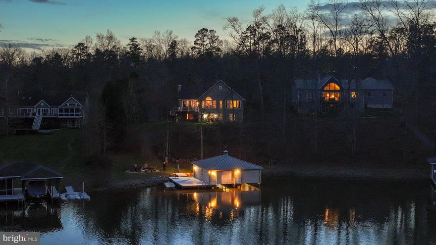Welcome to lakefront living on the public side of Lake Anna in the Freshwater Estates community, ideally positioned for convenient access to everything the lake has to enjoy. This custom-built home delivers a seamless blend of comfort, space, and year-round living, all set within a quiet, protected cove.

With five bedrooms and three full bathrooms across two levels, the home offers generous space for both everyday living and hosting. The interior is highlighted by vaulted ceilings and a striking wood-burning stone fireplace that anchors the main living area, creating a warm and inviting feel. The family room flows seamlessly into the kitchen, featuring custom cabinetry, stainless steel appliances, and granite countertops, along with a spacious island ideal for gathering. Designed to take full advantage of its setting, the home captures water views from nearly every room, making the lake a constant backdrop. 

Step outside to a waterfront setting thoughtfully designed for both relaxation and recreation. A private covered boathouse with two slips—one equipped with an electric lift—pairs with a spacious dock to create an exceptional setup for life on the water. Tucked within a wide, protected cove, the property invites swimming, kayaking, paddleboarding, and fishing, with approximately 6 feet of water depth off the dock. From here, enjoy the perfect balance of serene cove living and effortless access to wide open water—ideal for boating, skiing, wakeboarding, and full days on the lake. 

Previously part of a successful short-term rental program, this property offers excellent flexibility for both personal use and investment potential, with short-term rentals permitted within the community.

Conveniently located within easy reach of Richmond, Washington, D.C., and Northern Virginia, this home offers an ideal getaway without feeling far from home. In close proximity to area favorites including Cutalong Golf Club, Tim’s at Lake Anna, Callie Opie’s Orchard, and Lake Anna Winery, you’ll enjoy both the lake lifestyle and easy access to some of the area’s most popular destinations. 

Whether you’re looking for a full-time residence, a weekend retreat, or an income-producing property, this home captures the laid-back lifestyle Lake Anna is known for—where days are spent on the water and evenings unwind with peaceful sunsets and storytelling by the fire.