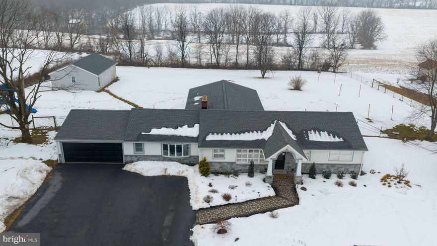 Exceptionally Updated and Expanded, one story, Ranch style home, situated on a beautiful 1.12 acre lot, in Lower Heidelberg Township, within the ever-popular Wilson School of Berks County! This home has undergone a complete transformation, over the past 2 years, from the brand new gourmet kitchen, with white cabinetry and quartz counter tops and tile floors, new mudroom addition, new laundry room addition, new powder room addition, new rear family room addition with windows on all three sides, vaulted ceiling, 24'X24" ceramic tile floors, and corner propane gas fireplace with propane gas mini split heating and cooling system, completely renovated family bath on the main level, a completely renovated lower level rec room, with full bar and brand new full bath, detached home gym/studio/work shop with attached 3rd  garage bay, and fully fenced rear yard, that backs to a farm in Clean & Green. Extensive foundation and drainage work has been done to create a bone dry lower level, 2 car attached garage with opener with expanding parking and turn around area to the driveway, with Blue Marsh Lake and Recreation Area immediately across the street. This home has extremely low taxes, has a country feel to it, yet is less than 10 minutes to everything that Spring Township, Sinking Spring and Wyomissing has to offer. This home literally HAS IT ALL and is waiting for you to come see it in person!