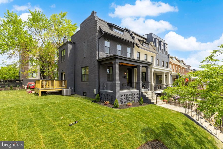 **Offers Due Thursday May 8th by 5pm**
Welcome to 200 Randolph Place NE — a stunningly reimagined end-unit rowhome that blends classic DC charm with contemporary elegance. Boasting 4 bedrooms, 3.5 bathrooms, and a private parking space, this residence offers the perfect balance of luxury, space, and functionality in the heart of the city.

Step inside to discover a bright, open-concept main level featuring wide plank hardwood floors, soaring ceilings, and a striking exposed brick accent wall. The living and dining areas flow seamlessly into a designer kitchen equipped with white shaker cabinetry, gold hardware, marble-style quartz countertops, a pot filler, and a spacious island with plenty of seating—ideal for both cooking and entertaining. The sun-filled dining area opens to a newly built rear deck overlooking the landscaped yard and stone patio, perfect for al fresco dining or your morning coffee.

Upstairs, you’ll find serene bedrooms including a spacious primary suite with spa-like bath finishes. The lower level offers a flexible family room or guest suite complete with a bedroom, full bath, and private entrance—ideal for a home office, recreation space, or even rental potential. The home also features a beautiful front porch with timeless architectural details, a large side yard that creates a rare urban oasis, and a private rear parking space. Modern lighting fixtures and premium finishes elevate every room throughout the residence.

Located on a picturesque, tree-lined block, 200 Randolph Place NE provides convenient access to local parks, shopping, dining, and public transit. It’s the perfect blend of tranquility and city living.