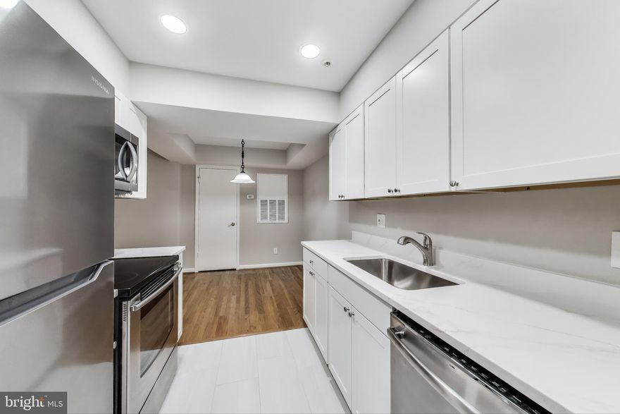 COOL REMODEL IN DONE - NEW KITCHEN CABINETS, FLOORING AND QUARTZ C-TOPS, NEW Tile FLOORING, NEW LIGHTING and FRESH PAINT & NEW HARDWOOD FLOORING IN THE BEDROOM....Quiet and peaceful ground-floor one bedroom in The Gables of North Bethesda! No stairs nor elevator needed. Spacious living/dining room area. Galley kitchen. Full size washer/dryer. Large bedroom with walk-in closet. Private front patio overlooking serene woods! Access to all of The Gable's luxury amenities including gym, outdoor pool, community center and tennis courts. Ample off street parking. Amazing location near North Bethesda Market, Whole Foods, Wildwood Shopping Center, Montgomery Mall, I-495, I-270, Rockville Pike, METRO Pike & Rose, & rock creek trail systems. Water included in rent!