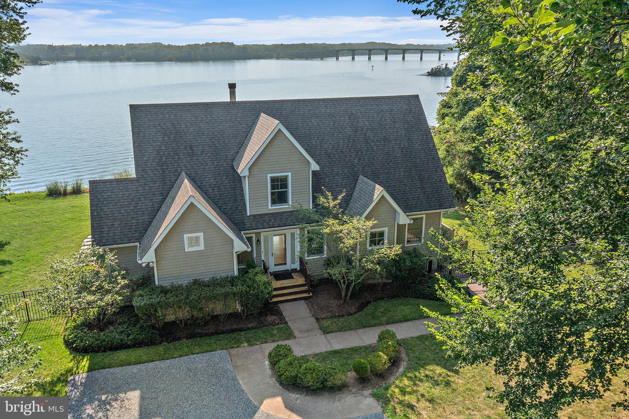 Discover the magic of life on the water with this enchanting storybook home nestled along the serene Severn River. Breathtaking panoramic river views from nearly every room. Spacious light-filled living areas with timeless architectural charm. Lush landscaped gardens for outdoor entertaining. Wake up to the gentle sound of the river, sip morning coffee as sailboats drift by, and enjoy evenings with spectacular sunsets. Enter on the stoned and tree lined road that opens to a high bluff overlooking the Severn River.
The perfect home for the discerning tenant. Hardwood floors and elegant finishes throughout. Open floor plan with a first-floor master, gourmet kitchen, enclosed porch, fireplace, and breathtaking views. Lower level boasts a private guest suite, family room and ample storage. Upper level houses 2 generously sized bedrooms that share a Jack-and-Jill bath. Privacy abounds with the spacious outdoor patio and expansive yard - all cared for by the landlord's contractor. Your only job is to enjoy this magnificent location. Close to the B&A bike trail and easy access to downtown Annapolis and major roadways. Minimum 2-year lease,