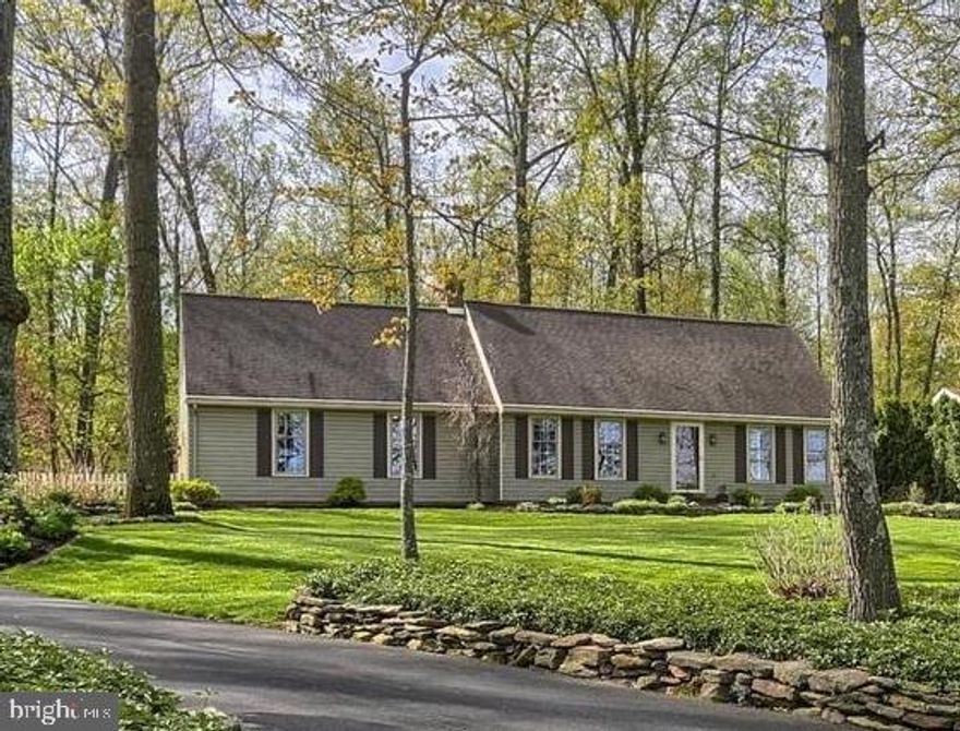 Beautiful landscaping with a quiet and peaceful setting! This spacious 5 bedroom cape cod is all ready to make your home ownership dreams come true! With large living room, fireplaces, custom family room, kitchen with cherry cabinets, and brick patio space, this home has both function and beauty combined! Large windows overlook handcrafted stone walls and multi-colored azaleas and hydrangeas! Formal dining room with glass paned doors and closet can easily convert to a bedroom. Partially finished basement boasts a soapstone woodstove for auxiliary heat. This meticulously cared for home will not last long! Schedule your showing today!