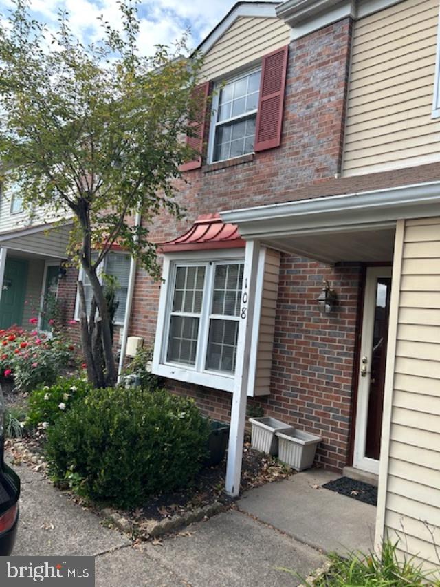 Welcome to 108 Brookwood Dr Ambler, Upper Dublin Twp. A lovely townhouse in a small cul-de-sac community known as the Brookwood Townhomes on the outskirts of Ambler,in a Blue Ribbon School District in central Montgomery Co. The Open floor plan of Dining Room and Living Room in a Great Room fashion, with a focal point of a wood fireplace and sliders to private deck at the base of a grassy slope. Enjoy for coffee, drinks or a BBQ dinner! The eat-in kitchen which greats you upon entry off the Hallway Foyer is warmly decorated with neutral paint as is in the expansive Living and Dining Room. Newer Hot water heater , Newer Garbage Disposal and Microwave, new Shower Door, Toilet and Vanity in Master Bath, Newer Windows throughout. New Vanity and Toilet in HallBath. The laundry closet completes the first floor. There are pull down steps up to the floored attic which offers more storage. Also, out front there is an outdoor storage room. Affording off street parking with 2 dedicated parking spots right out front! Close to route 309 and the PA turnpike in Ft Washington, the Bethlehem Pike corridor. Dining, strolling and the Movies or Plays of Ambler.
