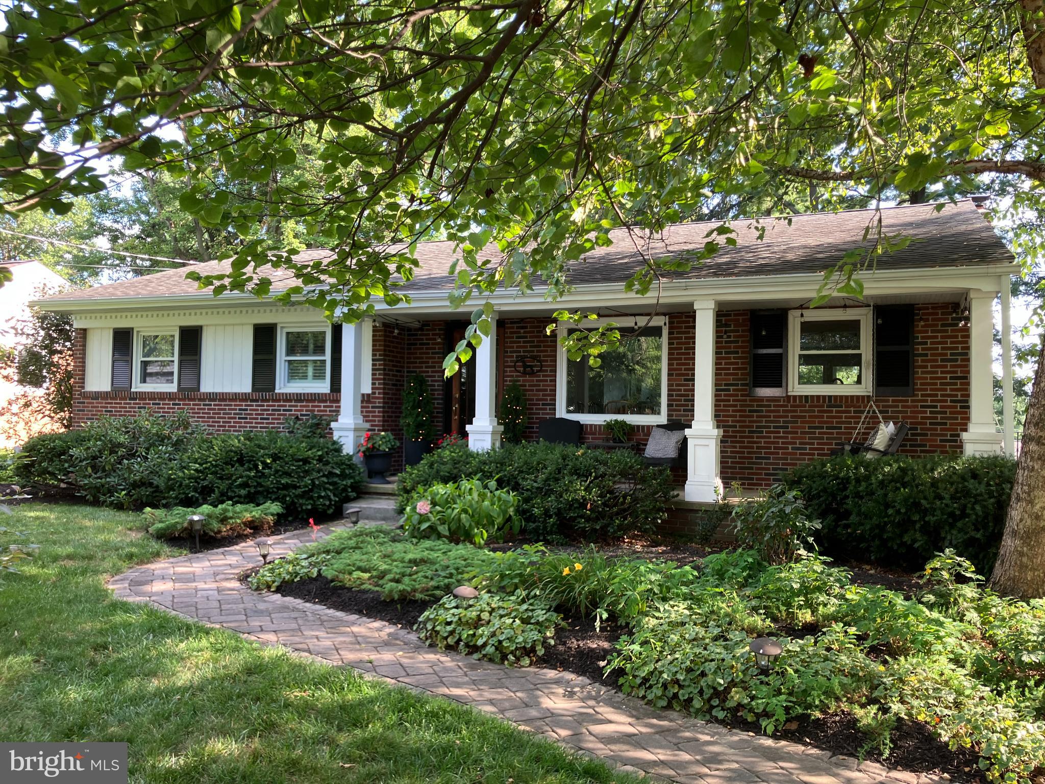 CHARMING UPDATED HOME IN A BEAUTIFUL SETTING ON A NICE QUIET BLOCK IN EAST HEMPFIELD. THE KITCHEN WITH A BREAKFAST BAR ISLAND HAS HARDWOOD FLOORING, QUARTZ COUNTERTOPS, AND UNDER CABINET LIGHTING. THE BRIGHT AND OPEN LIVING ROOM AND DINING AREA HAVE HARDWOOD FLOORING, LARGE WINDOWS, AND A STONE LIVING ROOM FIREPLACE WITH BUILT-INS ON EITHER SIDE. THERE IS HARDWOOD FLOORING THROUGHOUT ALL THE BEDROOMS AND THE FULL BATHROOM HAS A GRANITE COUNTERTOP, TUB AND SHOWER, TILE FLOORING, AND A LAUNDRY CHUTE. THE WALKOUT LOWER LEVEL HAS A FAMILY ROOM WITH TILE FLOORING, AND A GAS FIREPLACE WITH BRICK SURROUND AND BUILT-INS ON EITHER SIDE. THE FULL BATHROOM DOWNSTAIRS HAS A WALK-IN SHOWER, GRANITE COUNTERTOP AND TILE FLOORING. ENJOY THIS BEAUTIFUL MATURE SETTING WITH THE LARGE COVERED FRONT PORCH AND THE PRIVATE REAR PATIO AREA. THERE IS PLENTY OF OFF-STREET PARKING WITH A NEW BLACKTOP SURFACE AND AN OVERSIZED 2 CAR GARAGE, AND THE YARD IS FULLY FENCED AND GOOD FOR KIDS OR DOGS. THE SELLERS HAVE LIVED HERE 31 YEARS AND THEY’VE KEPT IT VERY WELL MAINTAINED. SET UP YOUR SHOWING SOON!