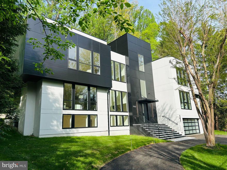 The Bannockburn Sanctuary: A 2026 Modern Masterpiece

Privately set within the prestigious Bannockburn neighborhood, this striking 6,000+ sq. ft. contemporary residence—fully reimagined for 2026—offers a rare blend of architectural scale and wooded serenity. Situated on a lush 0.71-acre lot backing to mature trees, the home provides a sense of calm that is increasingly rare.

The four-level floor plan is connected by a private elevator, ensuring seamless movement through light-filled spaces. At the heart of the home is a chef-inspired kitchen featuring waterfall quartz, a massive social island, and a premium Thermador appliance suite. The residence offers six generously sized en-suite bedrooms, including a spa-like primary retreat and a flexible main-level suite.

Outdoor living is elevated by multiple balconies and a signature roof deck with panoramic tree-lined views. 
Backyard that invites creativity and play. The natural slope offers a dynamic setting—perfect for kids to explore, play, and enjoy the outdoors.
The fully finished daylight lower level offers a private exterior entrance, ideal for a home gym, library, or home theater. Practical luxury abounds with an oversized 4-car garage with EV charging, a whole-house generator, and advanced energy-efficient systems. This is more than a home—it’s a private retreat designed for connection, comfort, and everyday elegance in one of Bethesda’s most desirable communities.