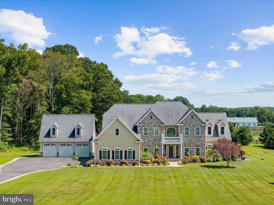 A Custom-Built Estate in Deale, Maryland – Where Grandeur Meets Comfort

Welcome to a one-of-a-kind custom estate boasting nearly 10,000 square feet of exquisitely designed living space on 5.59 private acres. This architectural masterpiece offers 7 bedrooms, 5.5 bathrooms, and an array of refined amenities that seamlessly blend elegance, function, and lifestyle. From the moment you enter the perfectly manicured drive, the home commands attention with its stone-and-siding façade and sprawling presence. Parking is effortless with an attached 3-car garage, complemented by an additional detached 3-car garage for car enthusiasts or extra storage. Step inside the dramatic two-story foyer, where a timeless staircase makes a grand impression. To the left, a formal dining room sets the stage for elegant gatherings; to the right, a refined living room exudes warmth. The true showstopper awaits in the great room: soaring 20-foot coffered ceilings, a striking stone fireplace that echoes the home’s exterior, and an expanse of windows framing breathtaking views of your private resort-style backyard. Outdoors, every day feels like a retreat. Dive into the sparkling saltwater pool with attached spa, or let the kids make a splash down the slide. Entertain under the shaded cabana, gather around the outdoor fireplace on crisp autumn evenings, and enjoy endless seating areas designed for relaxation and celebration. The gourmet kitchen is a chef’s dream, anchored by a grand center island and equipped with dual ovens, a gas cooktop, walk-in pantry, and an elegant Butler’s pantry. A main-level office provides serene backyard views, while the sunken Florida room floods with natural light—perfect for morning coffee or unwinding with a book. You’ll always be comfortable with the brand new (2025) HVAC units, yes! All three have been replaced! Upstairs, five generously sized bedrooms and four full bathrooms offer comfort and privacy for family and guests. The primary suite is a sanctuary of luxury, with tray ceilings, a private balcony, a sitting area, and a spa-inspired bath featuring dual vanities, a glass-tiled shower, a soaking tub, and a private water closet. The pièce de résistance? A custom walk-in closet spanning the entire length of the 3-car garage—an unrivaled space designed to impress. The lower level extends the living space with a fully finished basement, complete with a kitchenette, bar area, two additional bedrooms, and a full bath—ideal for an in-law suite, au pair quarters, or multigenerational living.

This Deale estate is not just a home—it’s a lifestyle. Whether hosting grand celebrations, enjoying quiet family evenings, or simply soaking in the beauty of your surroundings, this property offers it all. Located just 30 minutes south of Annapolis, 30 minutes to Washington DC & Northern Virginia it’s a commuters dream! Just 20 minutes to Joint Base Andrew’s.