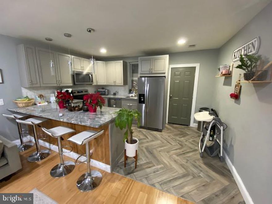 Beautiful New Rental Listing in Hunting Park.   Fully Renovated - This 3 Bedroom , 1 Full Bath unit features an Open Floor Concept with Hardwood Floors throughout and recessed lighting.  Living Room has 2 windows and Hardwood Floors.  Kitchen - Lots of Cabinets with Granite Countertops and Subway Tile Backsplash.   Spacious Hallway with separate laundry area.   Main Bedroom:  Huge with Hardwood Floors, Recessed Lighting separate Sitting/Dressing  or Work from Home office area and Nice Size Walk in Closet.   2nd Bedroom: Nice Size with Hardwood Floor and Closet.  Rear  Bedroom: Good Size with 2 Windows allowing Wonderful Natural light and Good closet space.   Convenient to many local stores, walking distance to Hunting Park and Temple University Hospital.   Easy to show.  Make your appointment today!