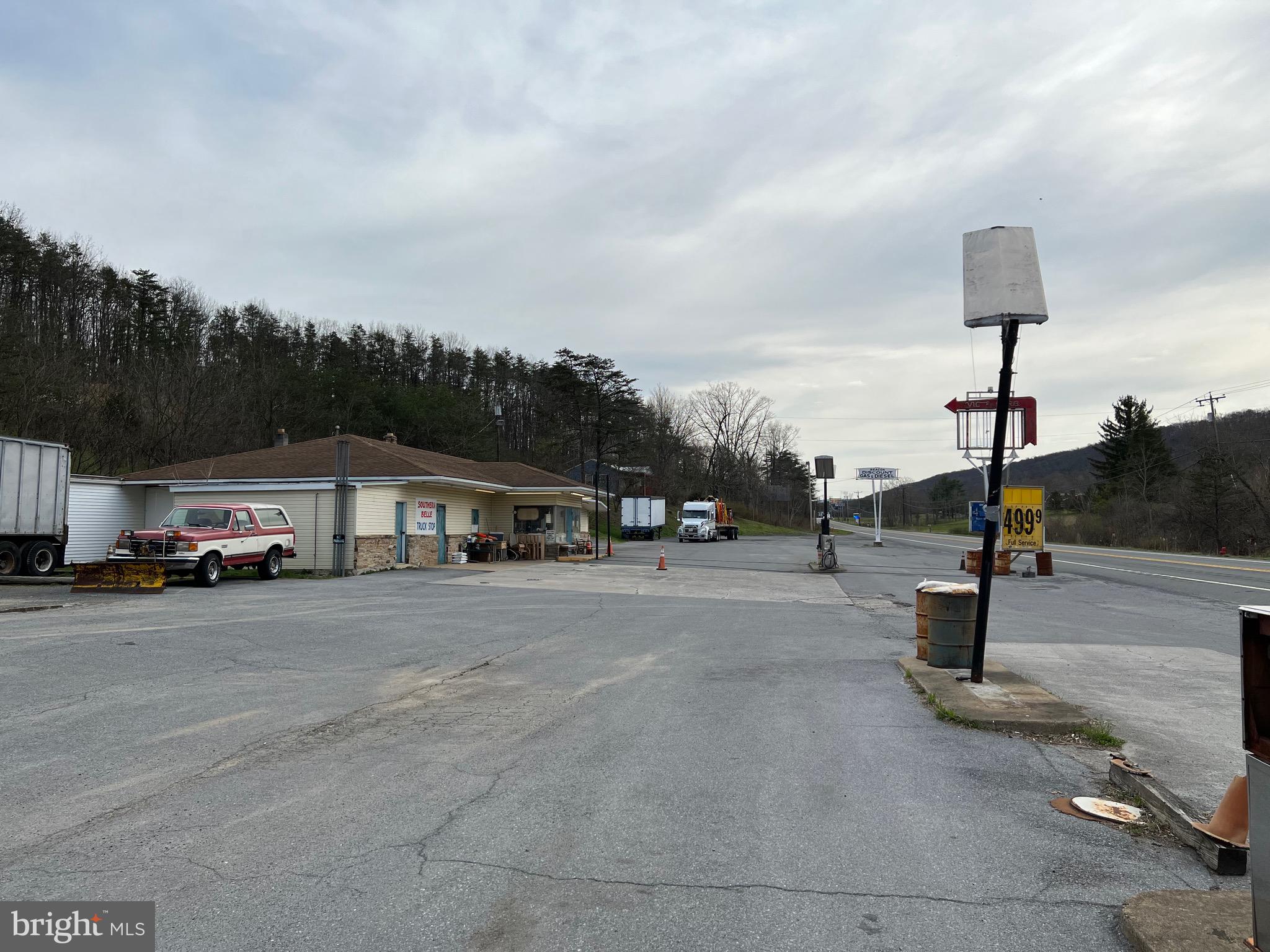 GREAT BUSINESS LOCATION - Explore the endless possibilities of building your own fast food restaurant, or other business! Located along busy US Route 522 in Berkeley Springs. Situated in a fast growing commercial location. This property features A 3100+ square foot building featuring multiple rooms, commercial kitchen, walk in cooler, walk in freezer, 3 restrooms, oil hot water baseboard heat, central ac, PUBLIC WATER & SEWER! Property is 2.75 acres.
If you need more space the adjoining parcel, 19.4 - 1.35 acres, featuring a 2 bedroom ,1 bath home built in 2018 is also available Contact listing agent for more information.