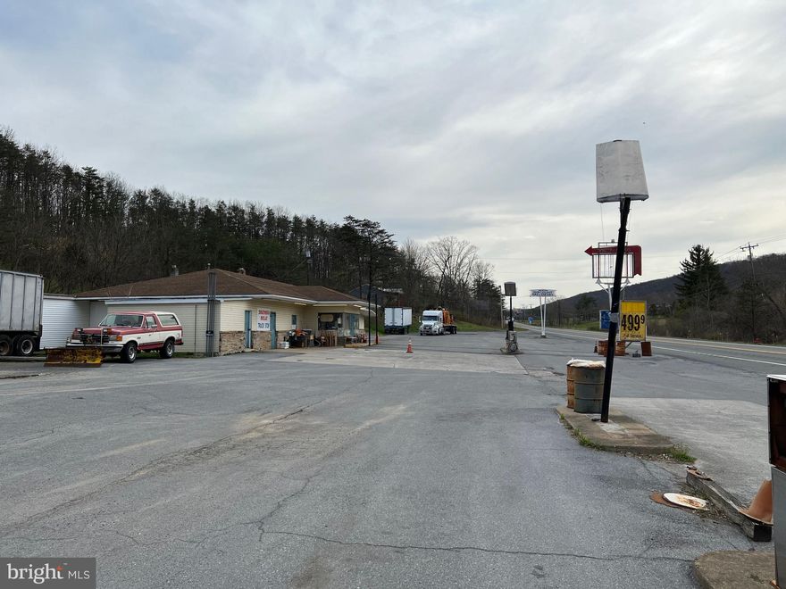 GREAT BUSINESS LOCATION  -  Explore the endless possibilities of  building your own fast food restaurant, or other business!  Located along busy US Route 522 in Berkeley Springs.   Situated in a fast growing commercial location.  This property features A 3100+ square foot building featuring multiple rooms, commercial kitchen, walk in cooler, walk in freezer, 3 restrooms, oil hot water baseboard heat, central ac, PUBLIC WATER & SEWER!  Property is 2.75 acres.