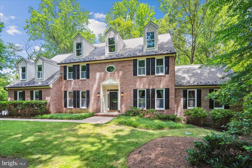 This expansive brick Colonial in Eagles Passages is move-in ready and located on just under an acre in the heart of Davidsonville! Offering over 7,000 square feet of thoughtfully designed living space, this property is perfect for entertaining and enjoying the outdoors.

The chef’s dream kitchen features a 5-foot island, double ovens, granite countertops, a breakfast bar, and an attached vaulted sunroom enhanced with the new windows.  Nearby, a redesigned mudroom and walk-in pantry add both function and charm. A two-story great room with a wood-burning fireplace and hardwood floors serves as the home’s central gathering space.  Just off the great room, a spacious game and billiard /music room with a gas fireplace and access to one of the home’s 3 decks creates a separate wing ideal for relaxing or hosting. The main level also includes formal living/library, formal dining room, along with a private home office.

Upstairs, the expansive primary suite offers a private deck, amazing California Closet / dressing room,  gas fireplace,  a bonus room for nursery / storage, and an en-suite bath with jetted tub.  An additional en-suite bedroom, plus two more bedrooms connected by a Jack-and-Jill bath, complete the upper level.

The finished walk out lower level provides even more space for entertaining or storage, featuring a large recreation room, multiple storage areas, and another full bathroom.  Auto enthusiasts will appreciate the attached garages with room for four cars, an EV charger, and a widened driveway for additional parking.

Outdoor living is just as impressive with three separate rear decks, copper gutters, and a spacious yard for sports!  Eagles Passages amenities include a community pool, pavilion, fishing and crabbing pier on the South River, basketball court, and tot lot.  All of this is just 12 minutes from Annapolis with easy access to major DC and Baltimore commuter routes!  Don't miss this rare opportunity complete with 2.39% VA Assumption option for a qualified VA Buyer!