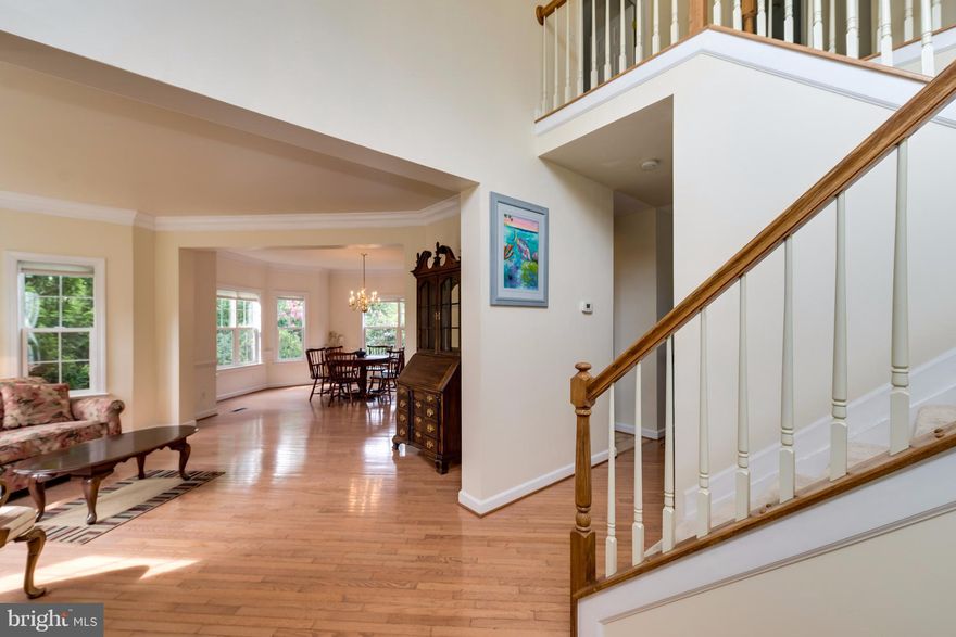 Beautiful home in sought-after Kingsview Ridge. New gas furnace and kitchen appliances, corian countertops, solid hickory  cabinets, 9 ft ceilings on first floor, bay windows with open floor plan. Freshly painted throughout, new carpet in family room with gas fireplace. Gorgeous landscaping, gardens and Koi pond. Flagstone patio leads to deck and screened porch. Private, backs to parkland. WOW!