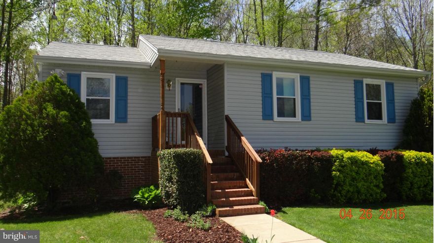 Darling Rambler on full finished  basement. Sits on a beautiful level 2+ Acre Lot.  New hardwood floors. Open floor plan.  Garage/storage building.Surrounded by woods. Walk out basement fully finished with a guest room/ full luxury bath w/ soaking tub and separate shower plus a den & mud room. 2 walk in closets in master bedroom. Cleared & Fenced area for small animals. Fountain & small pond..