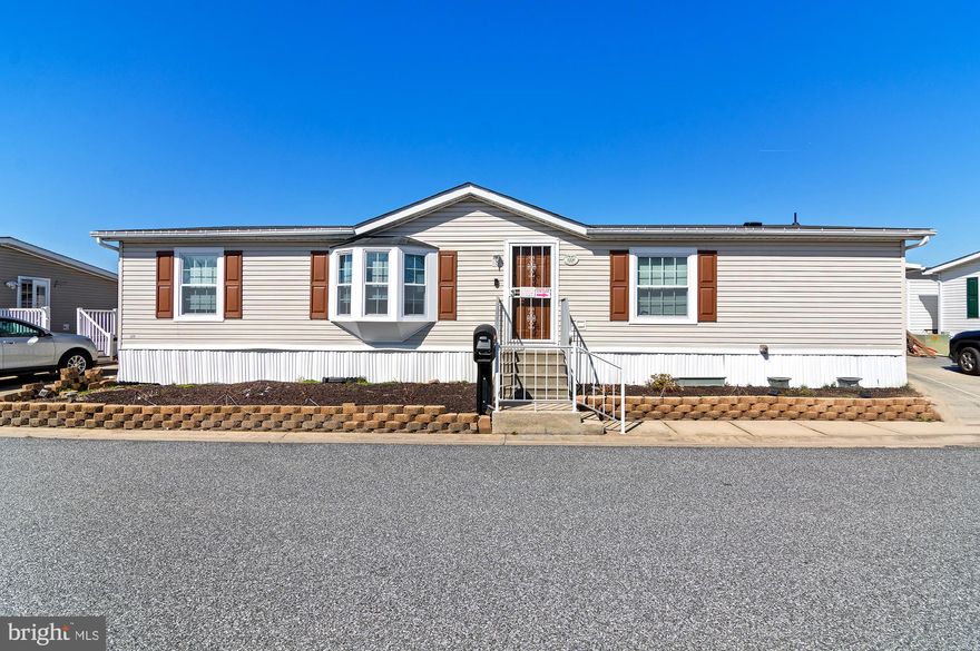 Just Listed!  Spacious mobile home in Peppermint Woods Community!  Loaded with upgrades and improvements!  Vaulted ceilings, laminate floors, large room sizes, open kitchen and much more!  Wrap around deck with wheelchair ramp.  Storage shed in rear yard.  New Roof - 2021; New Windows - August 2024; New AC - August 2024; New Countertops; New Dishwasher - Never been used.  Buyers must be approved by park.  Homes have been selling fast - make your appointment today!