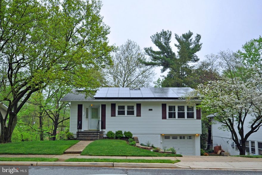 GREEN LIVING in a BLUE RIBBON SCHOOL DISTRICT! Recent roof, windows, doors & siding; geothermal heat & A/C; solar energy panels & whole house generator. Landscaped, private yard backs to trees & stream. Interior features wood floors, new carpet, renovated main bathroom & well-designed galley kitchen w/custom cabinets. Large addition w/outside entrance could be studio, workshop or play space.