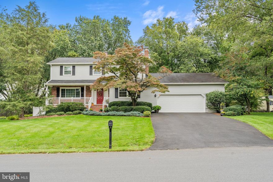 Stunning colonial that has been meticulously loved and beautifully updated by the original owners.  Please bring your pickiest buyers as they will not be disappointed! You will immediately be impressed by the curb appeal - the gorgeous lawn and landscaping welcome you to the coveted front porch that people love and desire.  The garage aficionado in your group may have also noticed the oversized garage! Once you step inside, you will immediately feel at home.  You are greeted by the family room to the right anchored with an impressive brick fireplace and to the left will take you to the dining area and sitting room. All paths lead to the impressive and fully remodeled kitchen with custom cabinetry, granite countertops and stainless steel appliances.  You may have caught a peek of the backyard extravaganza, but before heading outside don't miss the half bath (space to be converted to full if desired), laundry area and main level bedroom/office. If a main level primary suite is desired, it could easily be accomplished! Now we can head outside to take in the beauty and the fun that starts with a three season room with a vaulted ceiling.  This then leads to an expansive 3 tier deck that is ideal for BBQ's and crab feasts.  The backyard is simply gorgeous.  There is something blooming year round and you won't be able to miss how much love and care has gone into the yard and landscaping over the years. As we head upstairs, you will find a spacious primary bedroom with a spacious primary bath featuring double vanities and a jetted tub shower combo. The secondary bedroom is one of 3 additional bedrooms and is perfectly designed as it adjoins the hall bathroom for easy access.  The basement is unfinished, but it is framed for finishing if desired.  Their is a warrantied french drain installed for dryness and peace of mind. It is always exciting to present a home with so much love and care wrapped into it.  Priced perfectly for a quick sale, please don't hesitate as this one won't last long and homes like this don't come around often at this price point.