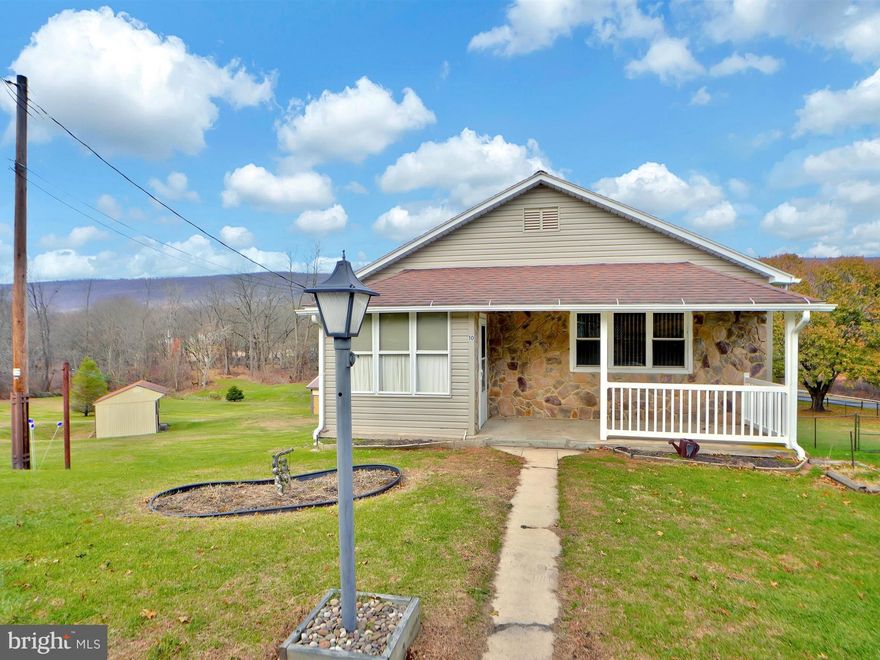 Looking for land and garage to park your toys?  This is the property for you!  Located outside of town on over 5.5 acres, this Tower City rancher offers 5 bedrooms and 2 full baths.  The eat in kitchen features quality cabinetry and plenty of room for storage.  The spacious first floor living room has a picture window.  3 Bedrooms are on the main floor with one leading to its own private deck which overlooks the land.  A full bath completes the first floor.  The walk out lower level features a rec room with a bar area for entertaining. Additionally, there are two sizable bedrooms and a laundry/full bath.  The finished lower level leads out to a porch/deck area which accesses the driveway and rear yard. An oversized two car garage and shed offers plenty of storage.  The acreage includes both open and wooded areas as well as a stream at the rear of the property. Property consists of four total parcels. Enjoy the rural location yet convenient to major routes for easy commutes to Harrisburg and surrounding areas.