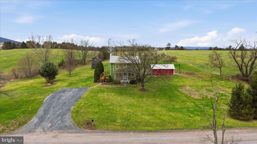 Charming 1899 Farmhouse, fully renovated in 2007, offering a perfect blend of historic character and modern updates on a scenic 2-acre lot with a small pond. This property features hardwood floors, wainscoting throughout, a durable metal roof, and a stunning stone wall with a wood stove. Recent upgrades include a 4-year-new pressure tank, water softener, and a newly re-stained deck. The exterior siding was painted in 2016, with fresh paint added this week to the front porch and pillars. Enjoy serene country living from the front porch, side deck, or the private second-floor deck off the primary bedroom. Complete with a barn, playhouse, and a workshop with electricity, this is a truly special place to call home.

Professional Photos Coming Soon!
