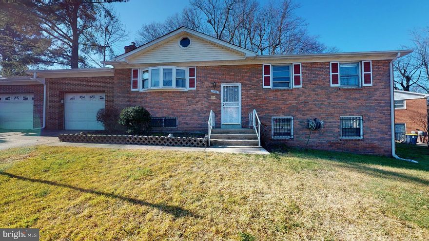 Super large all brick 5 bedroom split foyer home (3 Br up and 2 Br down)  with 2 car attached garage and huge deck and screened porch off the rear yard.  Warm natural gas utilities...Newer kitchen updates, oak hardwoods on the main level.  Large living room and family room.  All brick fireplace.   Double driveway, great rear yard and so much more.  This home features a newer architectural shingle roof and fresh paint.   Your new home awaits you.